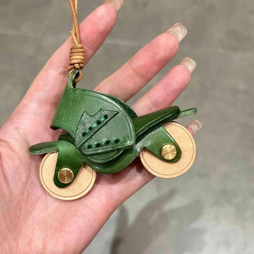 Handcrafted genuine leather motorcycle pendant decor from Bean's Moto Booth featuring detailed leather craftsmanship.