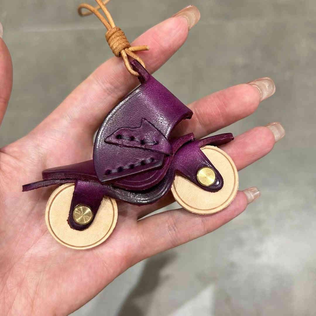 Handcrafted genuine leather motorcycle pendant decor with detailed design, featuring a rugged, stylish look for motorcycle enthusiasts.