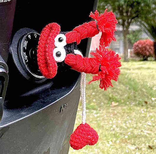 Cute motorcycle key cover decor by Bean's Moto Booth featuring a quirky, colorful motorcycle design on a key cover.