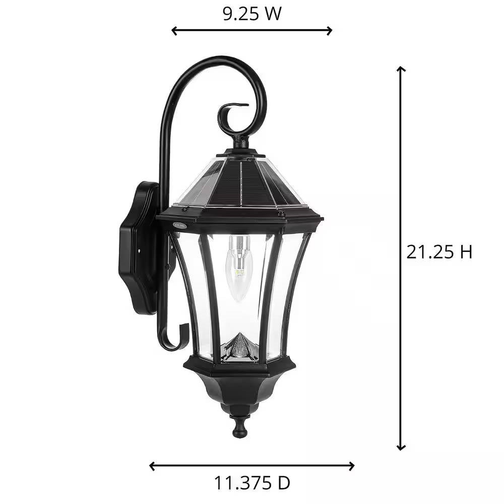 Black outdoor farmhouse solar wall light with 150 lumens, mounted on exterior wall, featuring a classic design and solar panel.