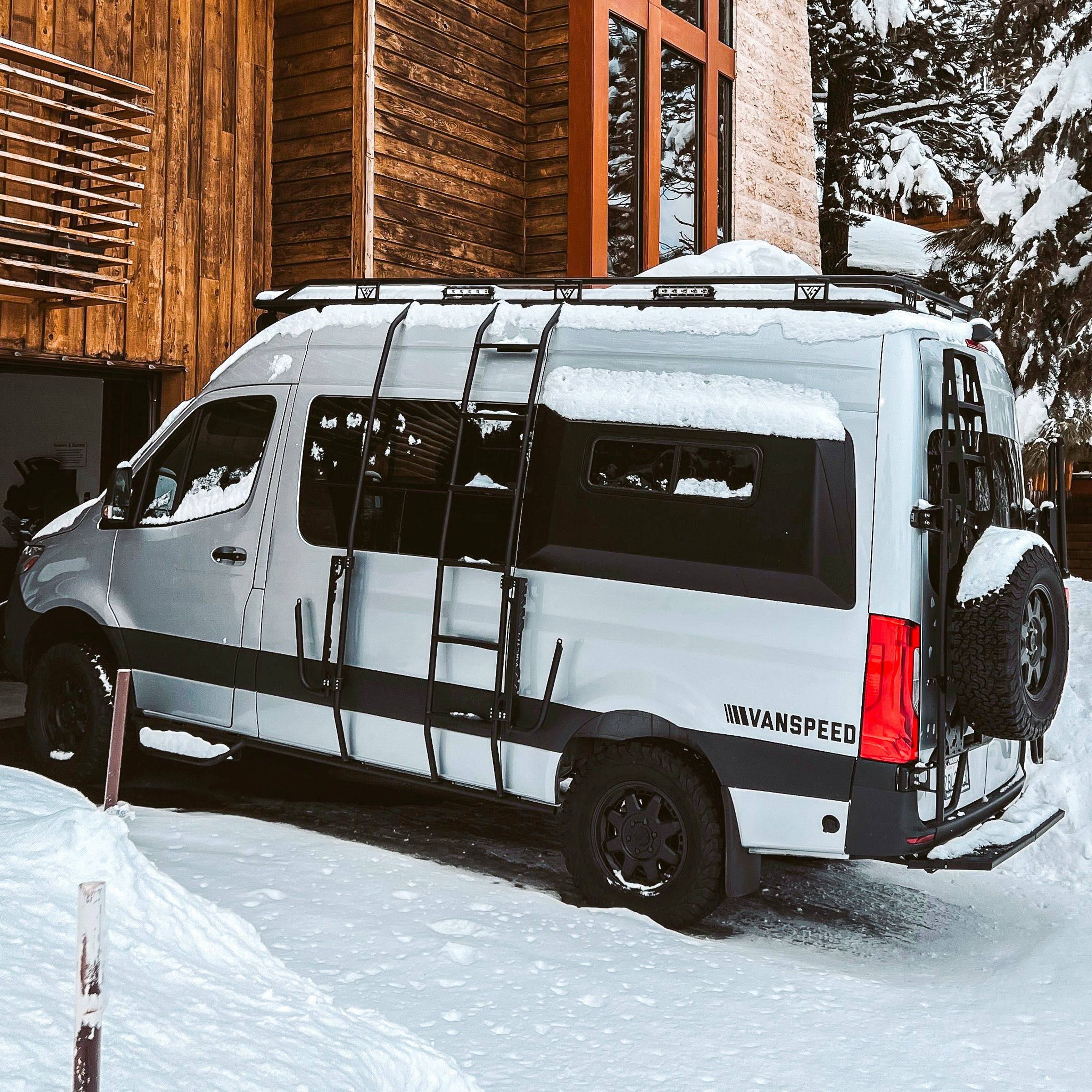 Vanspeed Sprinter side ladder installed on a van, exterior part for easy roof access, branded by The Van Mart.