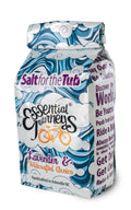 Lavender and arnica bath salts in a glass jar, showing the colorful salts for a relaxing tub soak by Essential Journeys.