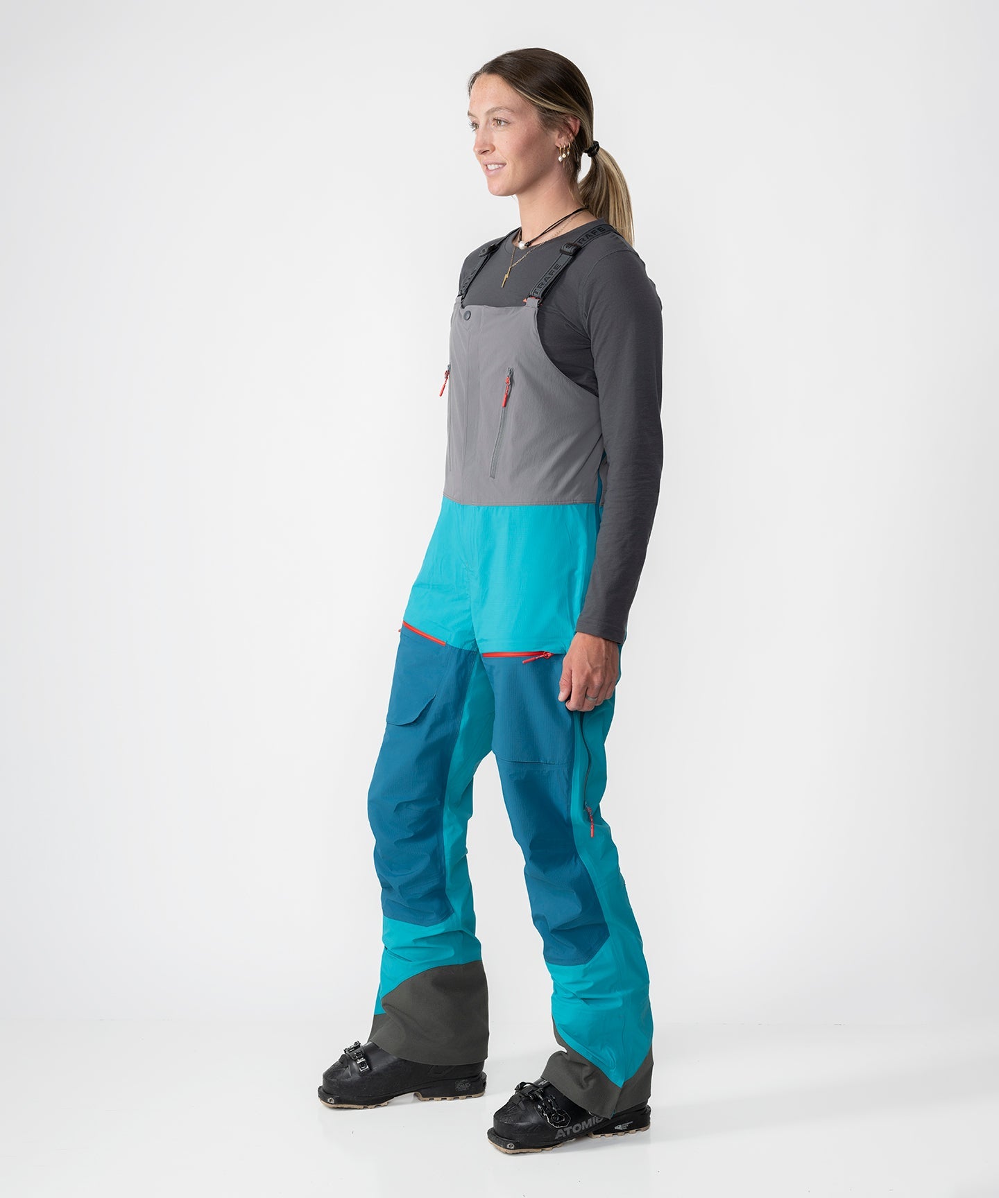 Strafe Outerwear Scarlett 3L Shell Bib pants in Lagoon color, featuring a waterproof design and adjustable straps.