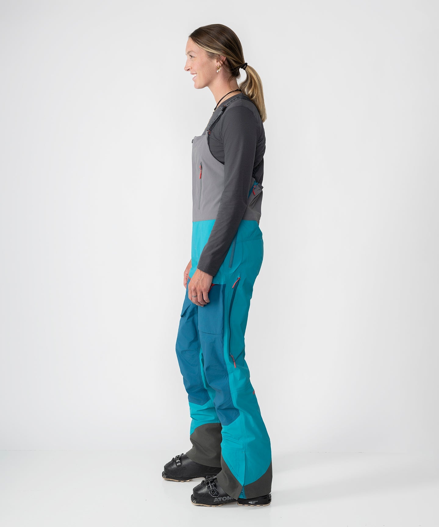 Strafe Outerwear Scarlett 3L Shell Bib pants in Lagoon color, showcasing waterproof fabric and adjustable straps.