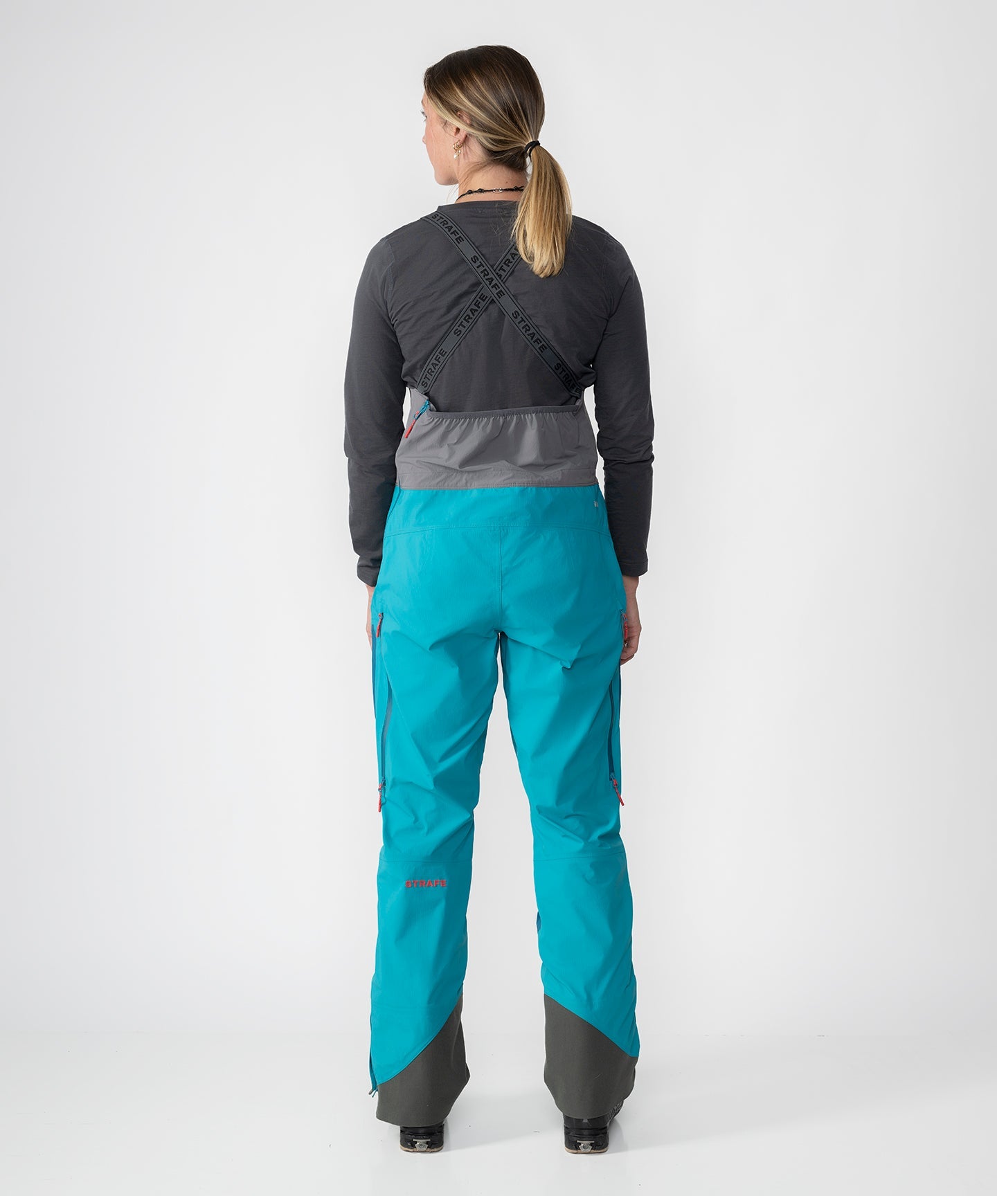 Scarlett 3L Shell Bib pants in Lagoon color, showcasing sleek design and durable fabric for outdoor activities.