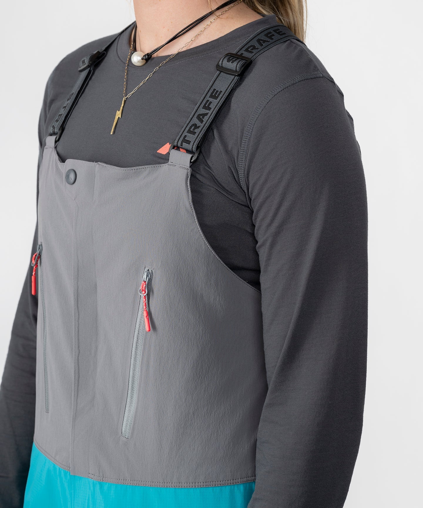 Strafe Outerwear Scarlett 3L Shell Bib pants in lagoon color, showcasing durable fabric and functional design for outdoor activities.