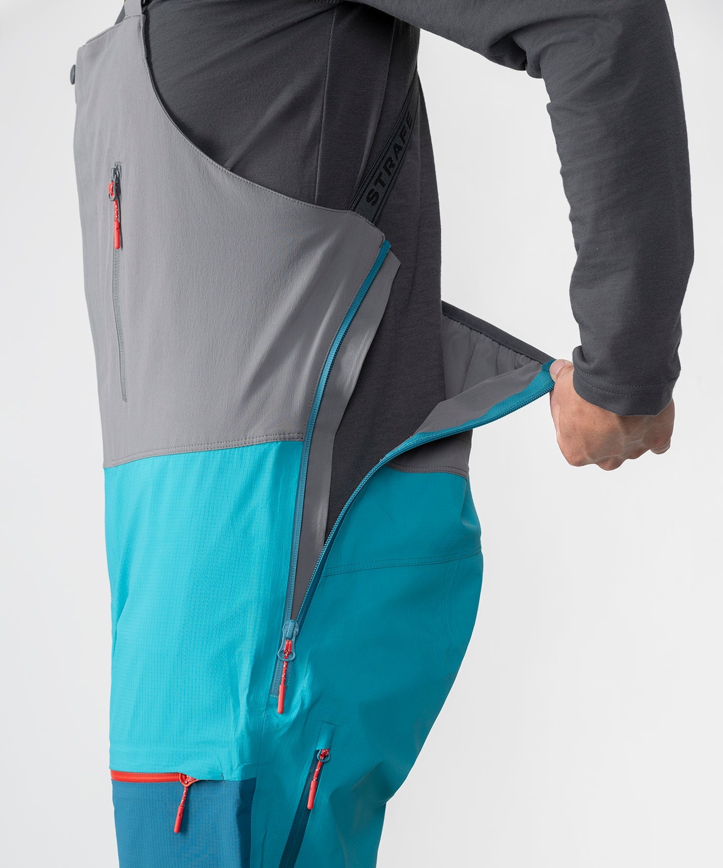 Strafe Outerwear Scarlett 3L Shell Bib pants in Lagoon, showcasing durable fabric and adjustable straps for outdoor activities.