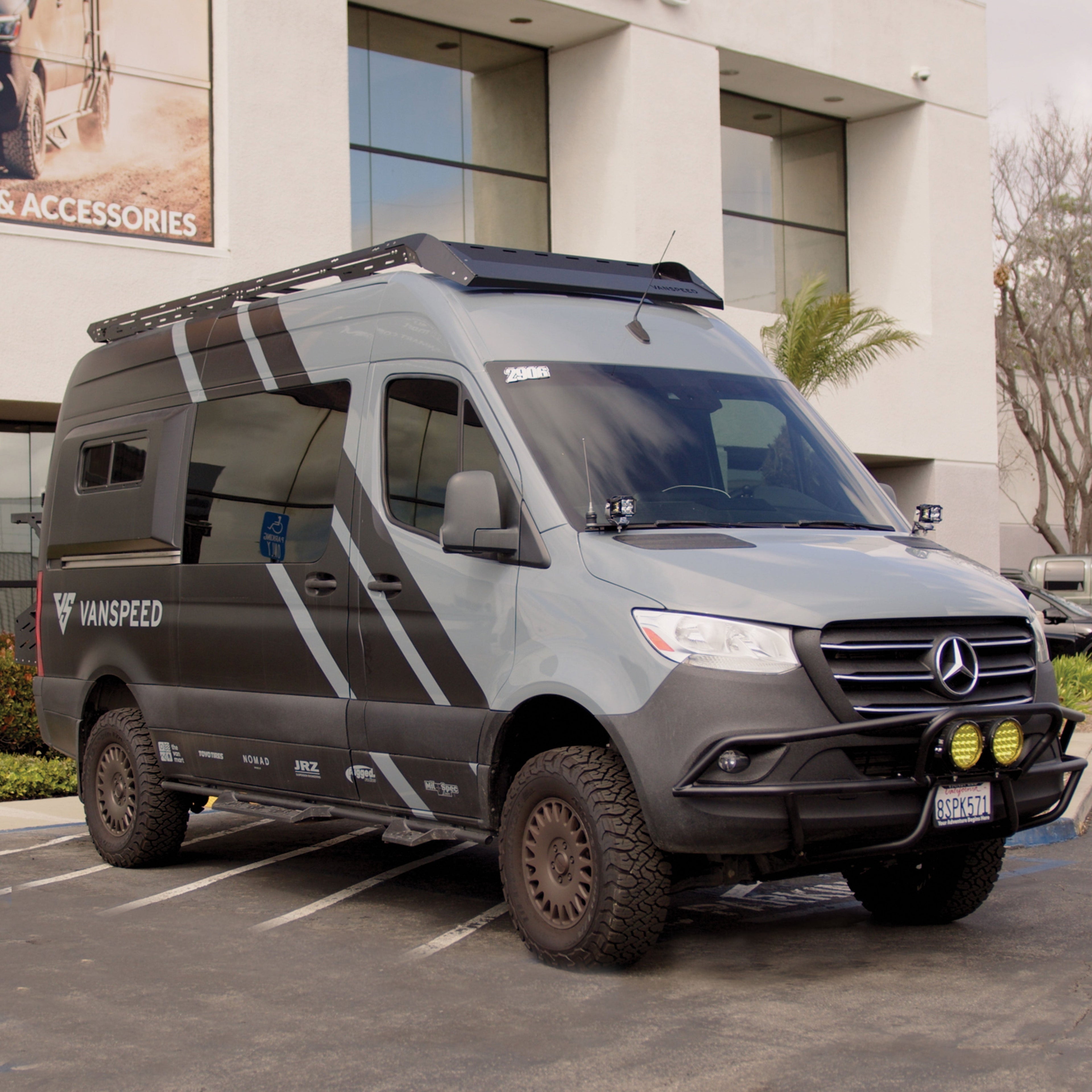 The Van Mart Sprinter Scout Rack 144 mounted on a van, showcasing its sturdy design and versatility for outdoor gear.