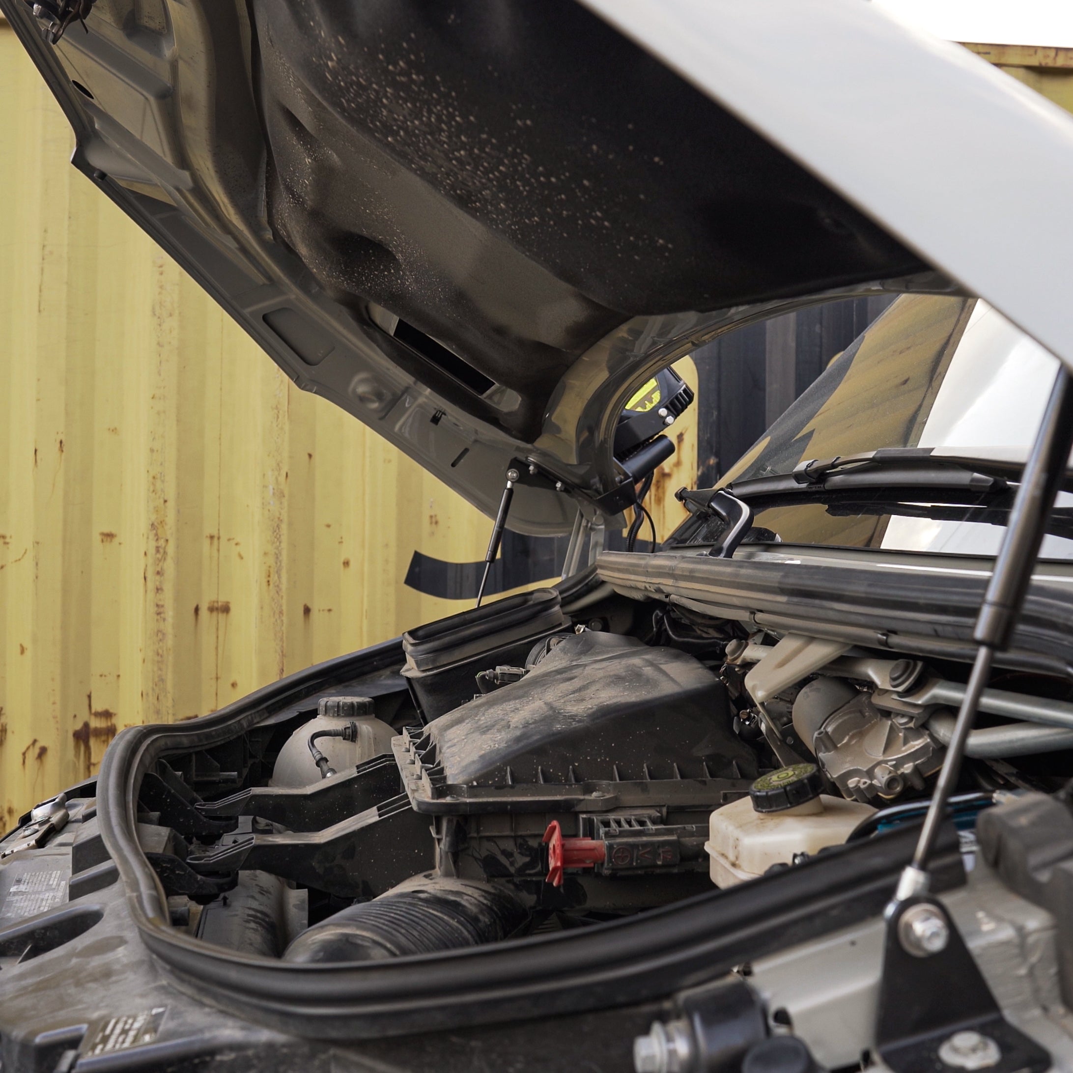 Sprinter hydraulic hood strut kit by Vanspeed Performance, showcasing sturdy struts for easy hood support and access.