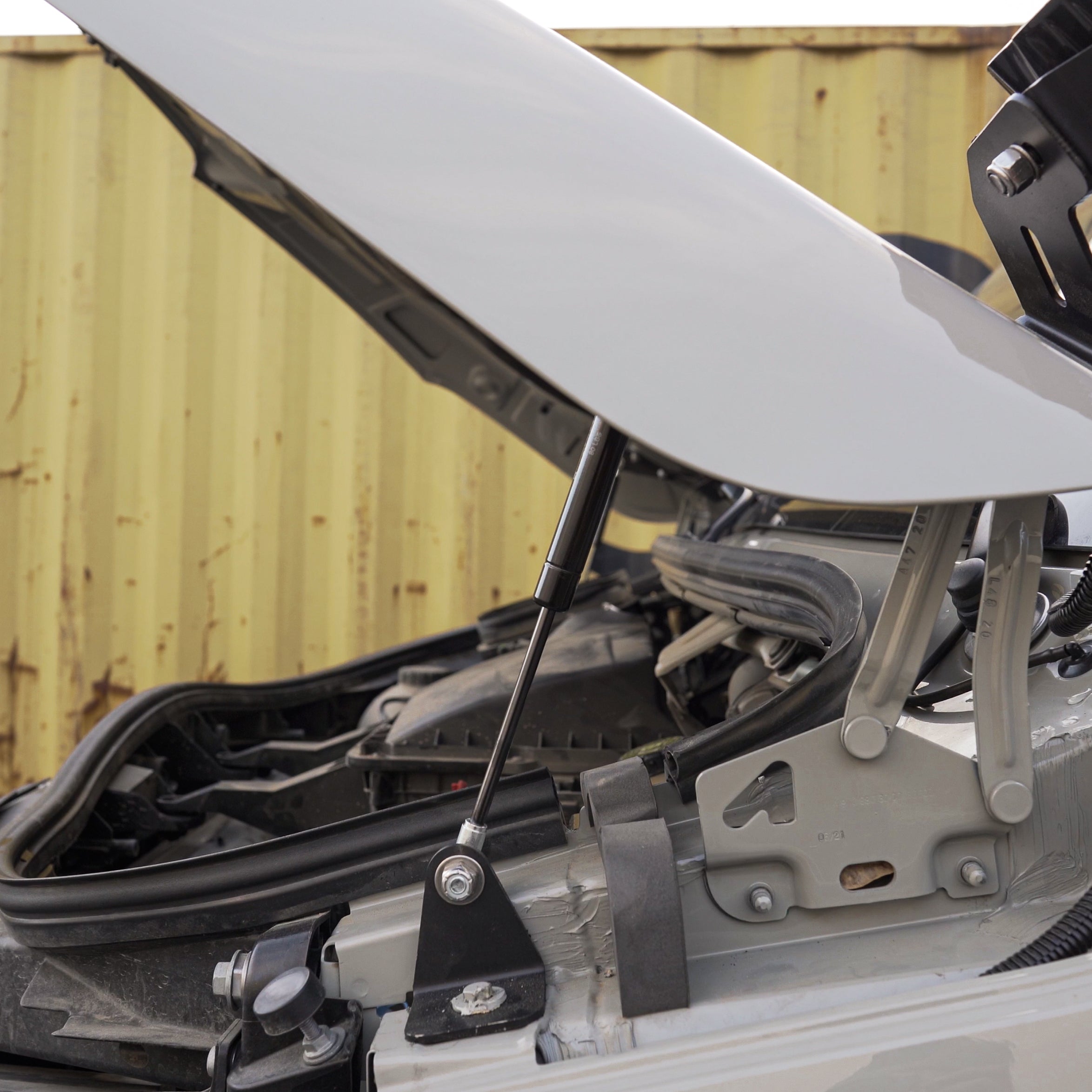 Sprinter hydraulic hood strut kit by Vanspeed Performance, showcasing durable struts for easy hood lifting.
