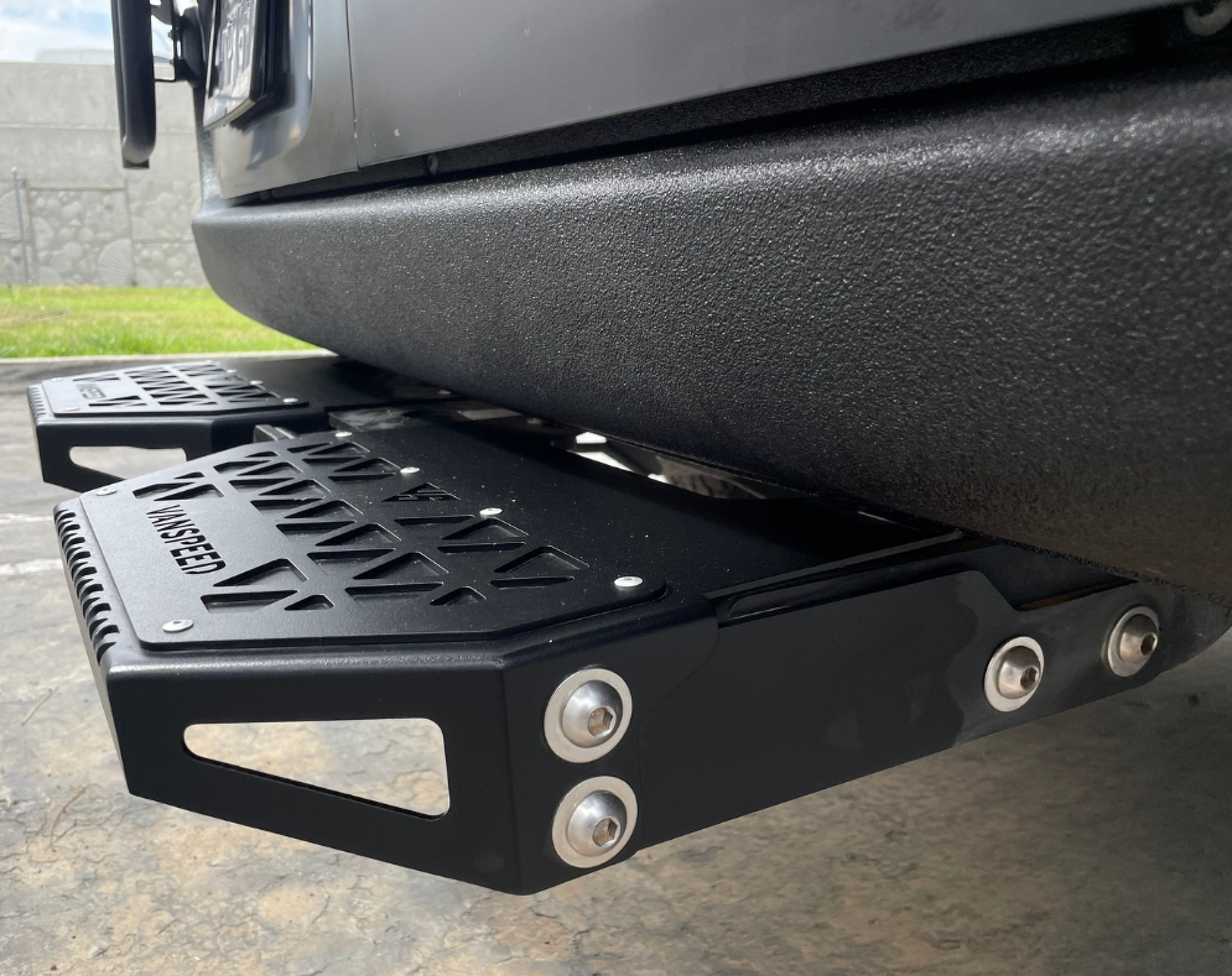 Sprinter Defender Mini Rear Step by The Van Mart, showcasing sleek design and durable construction for easy van access.