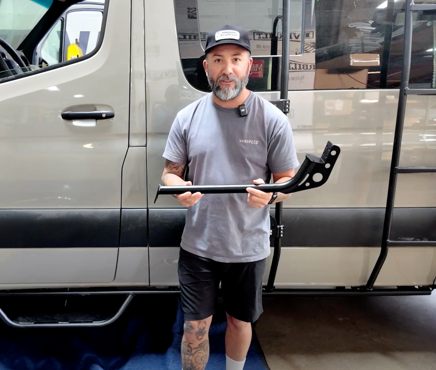 Sprinter Side Step Extra Curved Tube Support Part by The Van Mart, showcasing durable metal construction and sleek design.