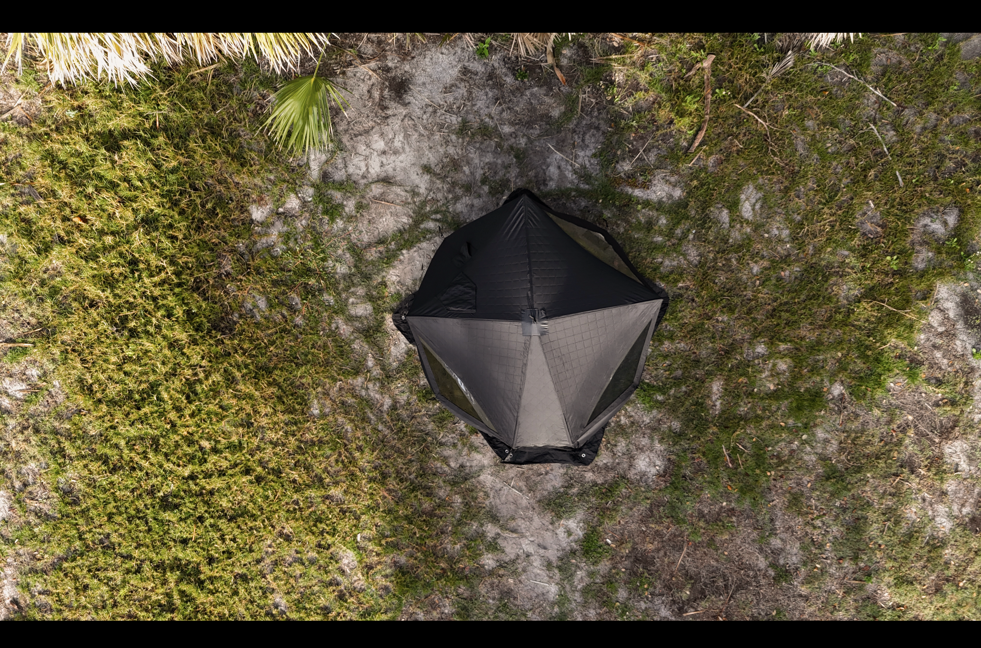 North Shore Sauna Nova 4 Sauna Tent for 4 people, showcasing the tent's structure and design in an outdoor setting.