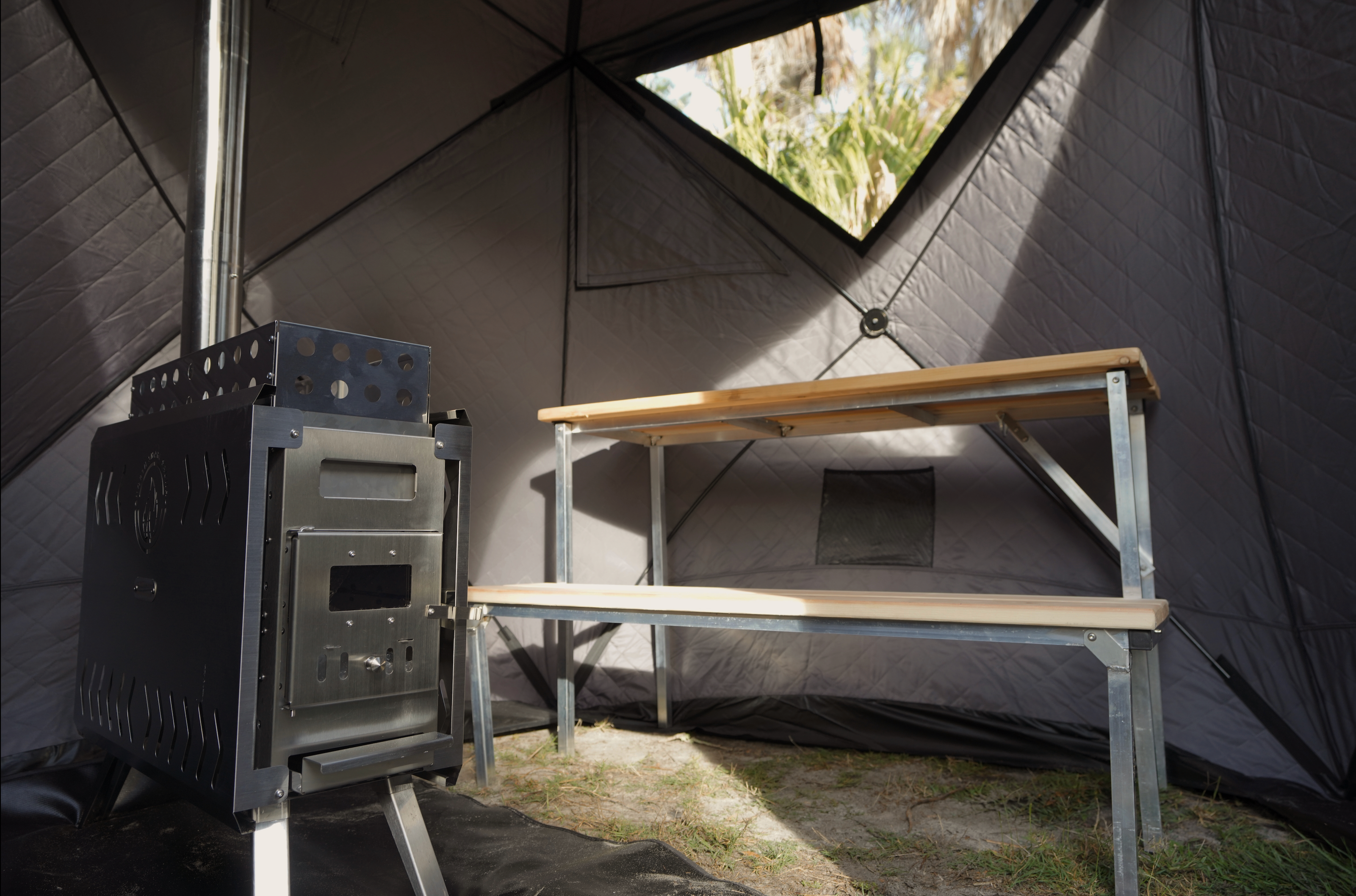 North Shore Sauna Nova 4 Sauna Tent Pro Package for four people, featuring a spacious and durable design in a natural setting.