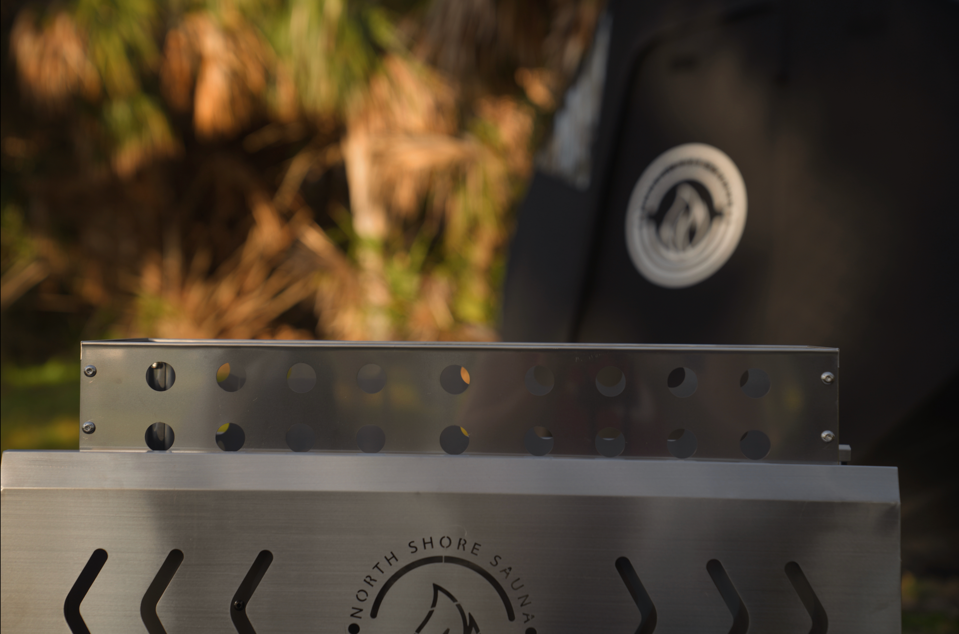 North Shore Sauna Standard Rock Basket filled with stones for optimal steam and relaxation in a sauna setting.