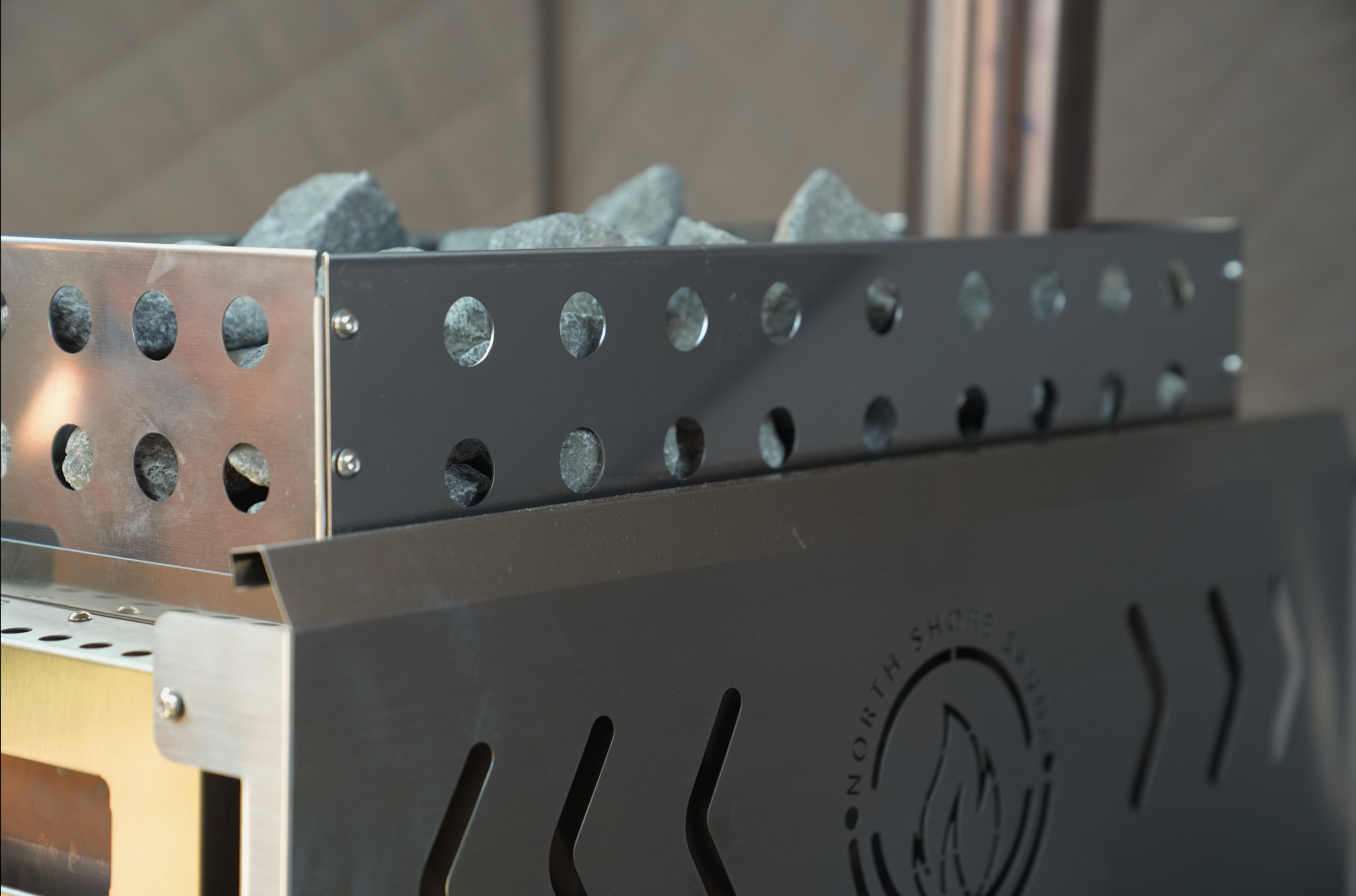 North Shore Sauna standard rock basket for sauna stove, designed to maximize steam and enhance relaxation.