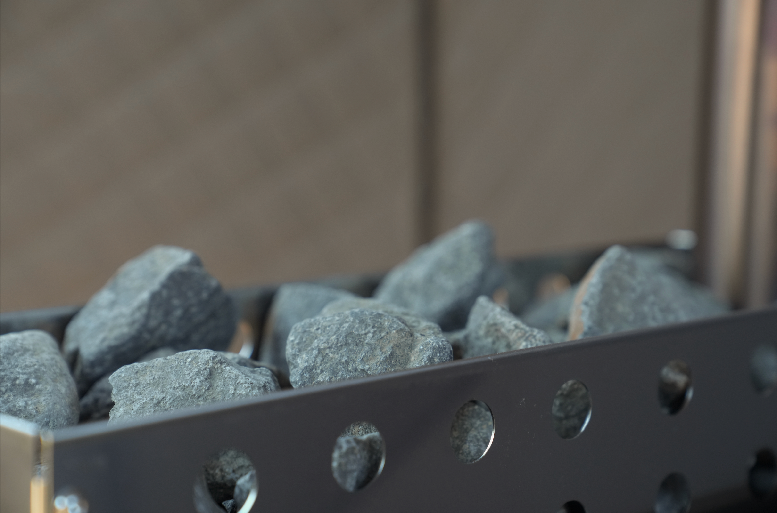 North Shore Sauna standard rock basket for sauna stove, designed to maximize steam and enhance relaxation.