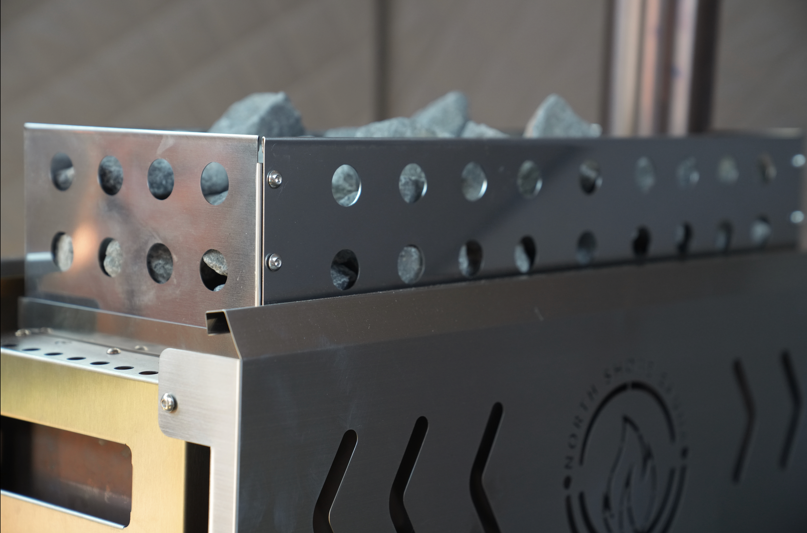 North Shore Sauna Standard Sauna Stove Rock Basket filled with natural stones, designed for optimal steam and relaxation.