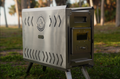 Portable North Shore Sauna tent wood stove in brushed stainless steel, showcasing its compact design and heating elements.