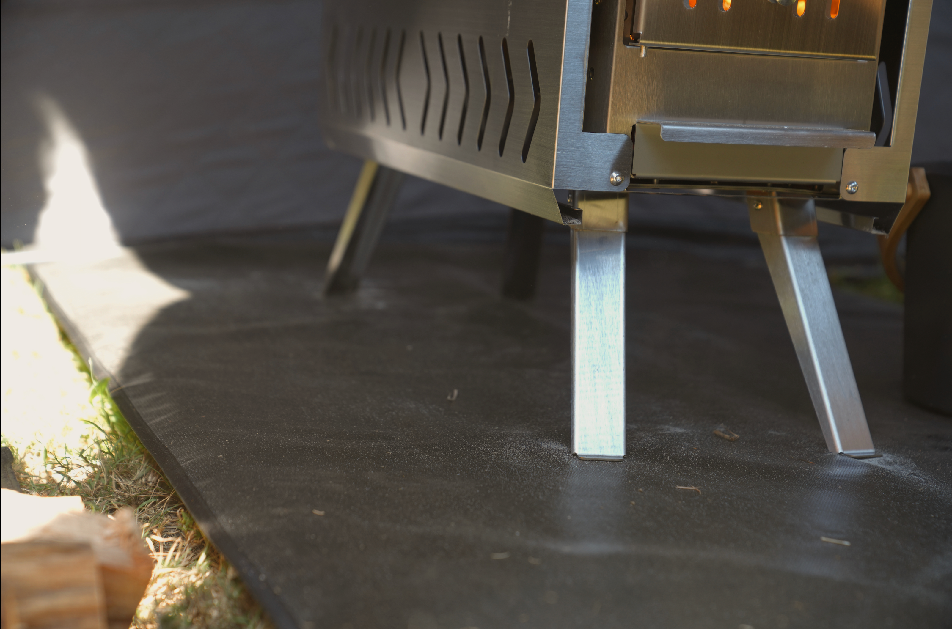 Durable fireproof mat for sauna stove by North Shore Sauna, showcasing a heat-resistant surface and protective design.