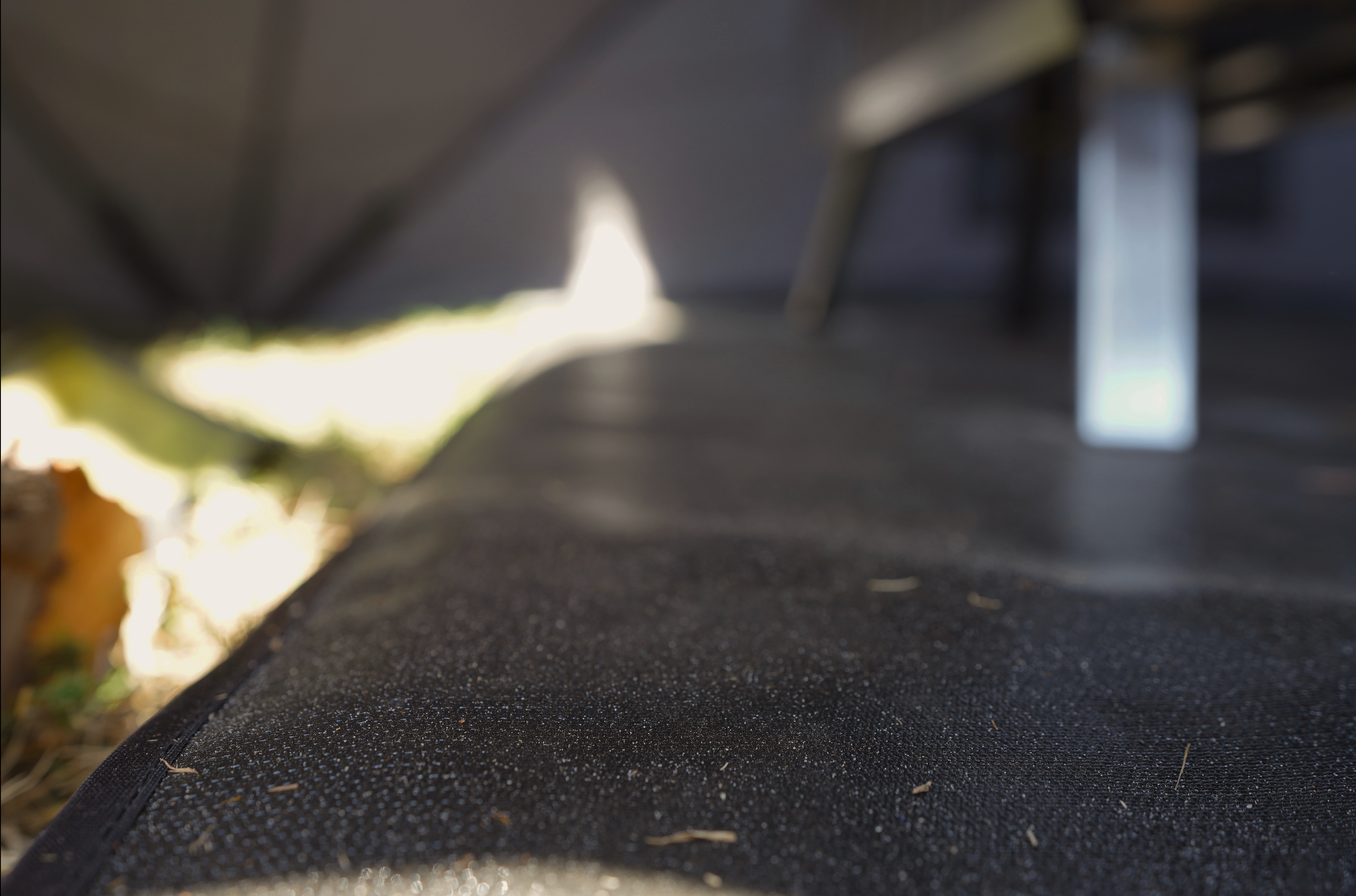 Durable fireproof mat for sauna stove by North Shore Sauna, featuring heat-resistant material and a textured surface.