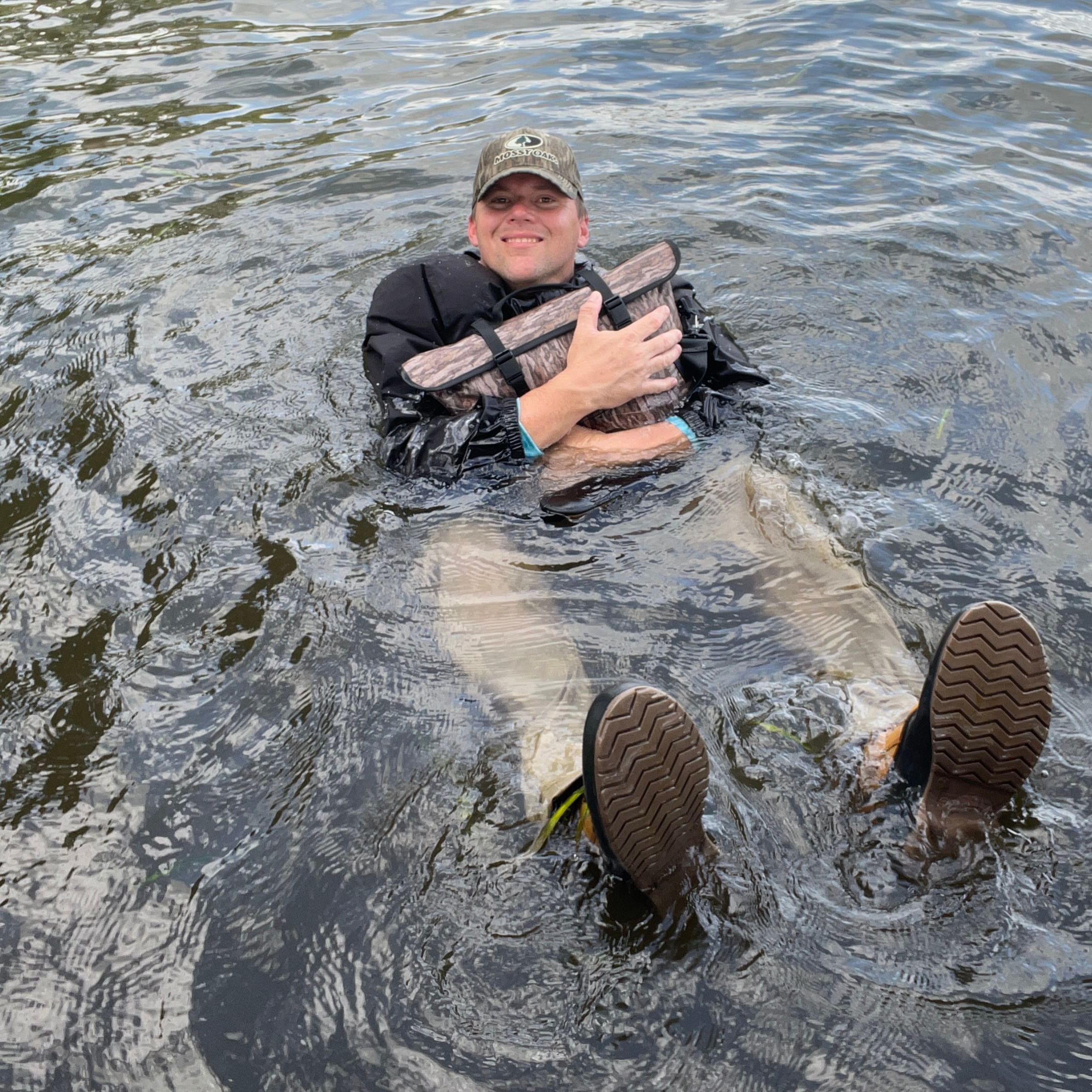 Dry Pocket waterproof floating cooler bag, auto-sealing tote with shadow grass pattern, ideal for outdoor and water activities.