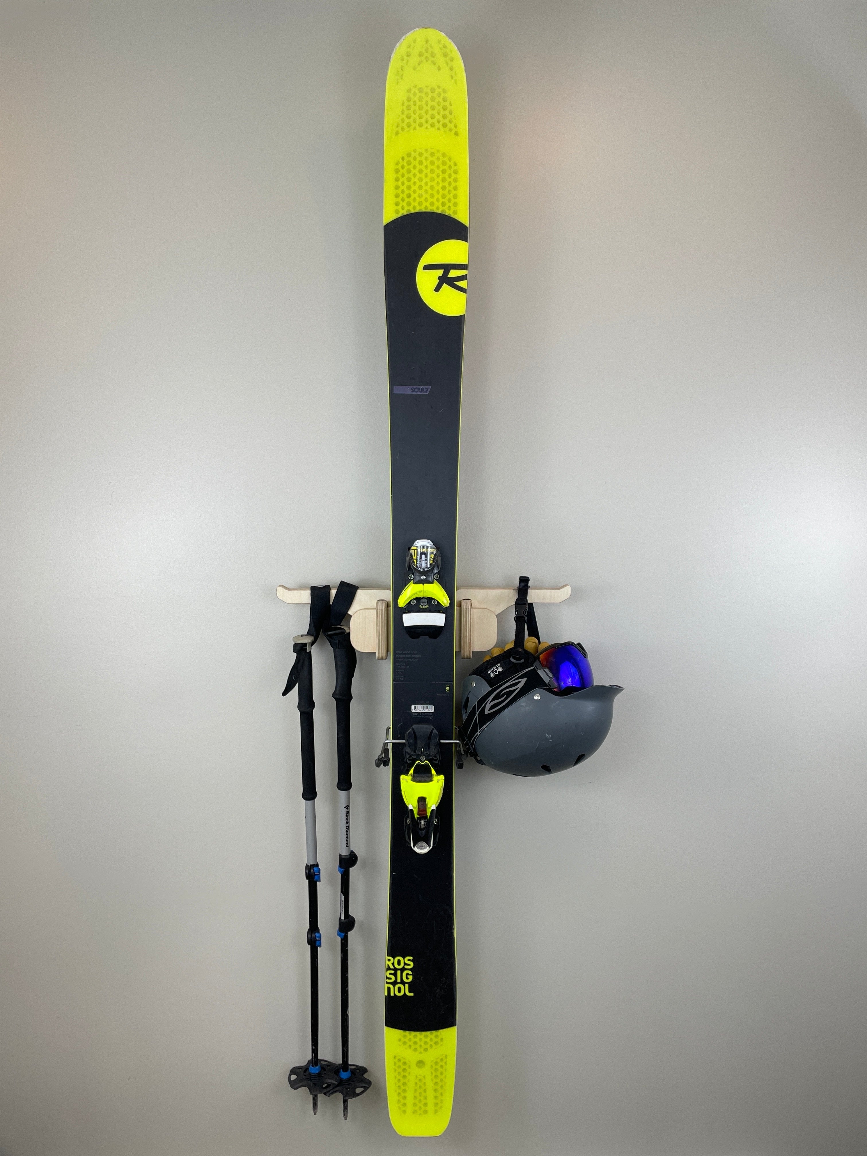 Rado Racks THE MOGUL ski storage rack holding skis in a modern home ski room.