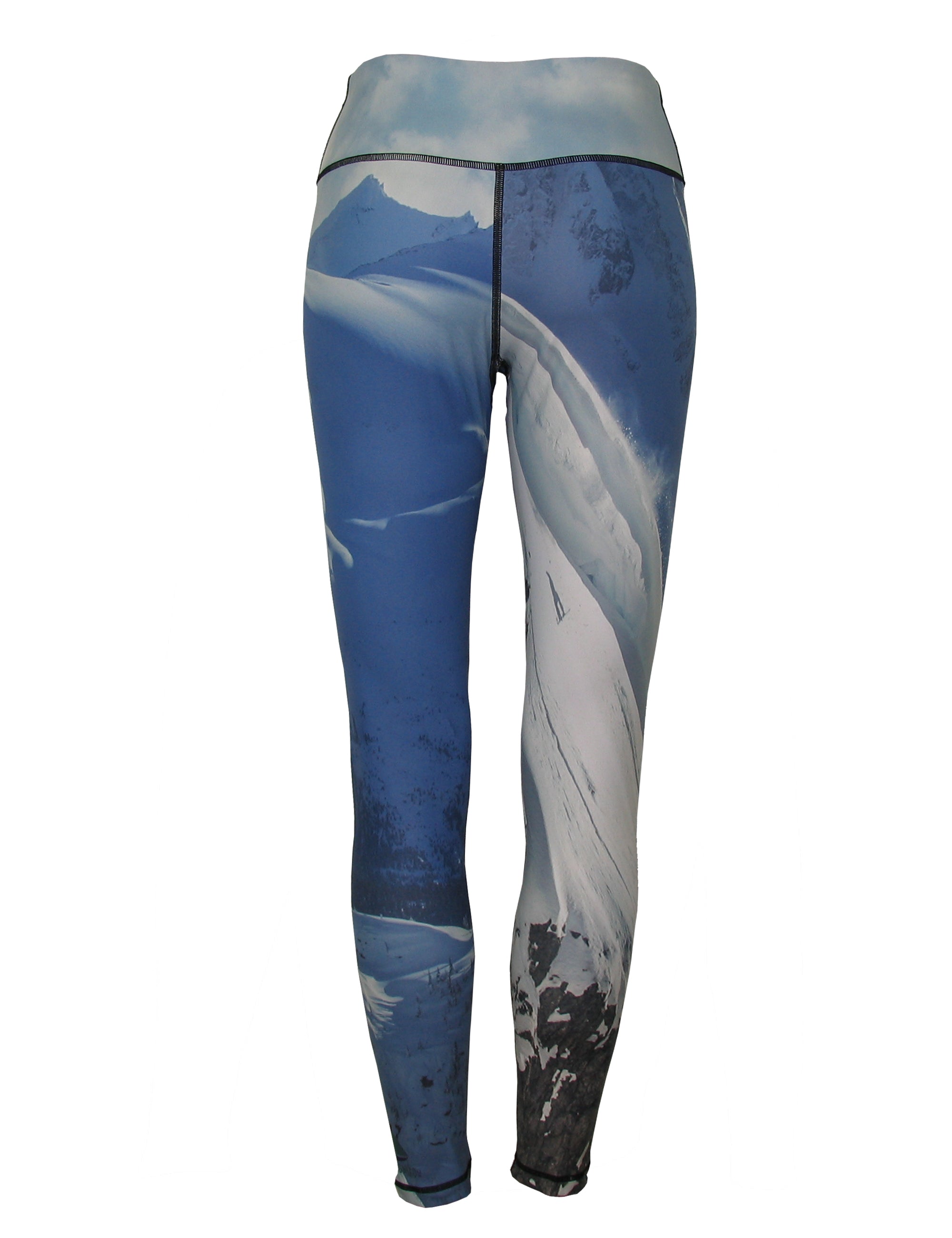 Back view of Cognito Brands snowboarder mountain print all sport leggings with vibrant winter-themed pattern.
