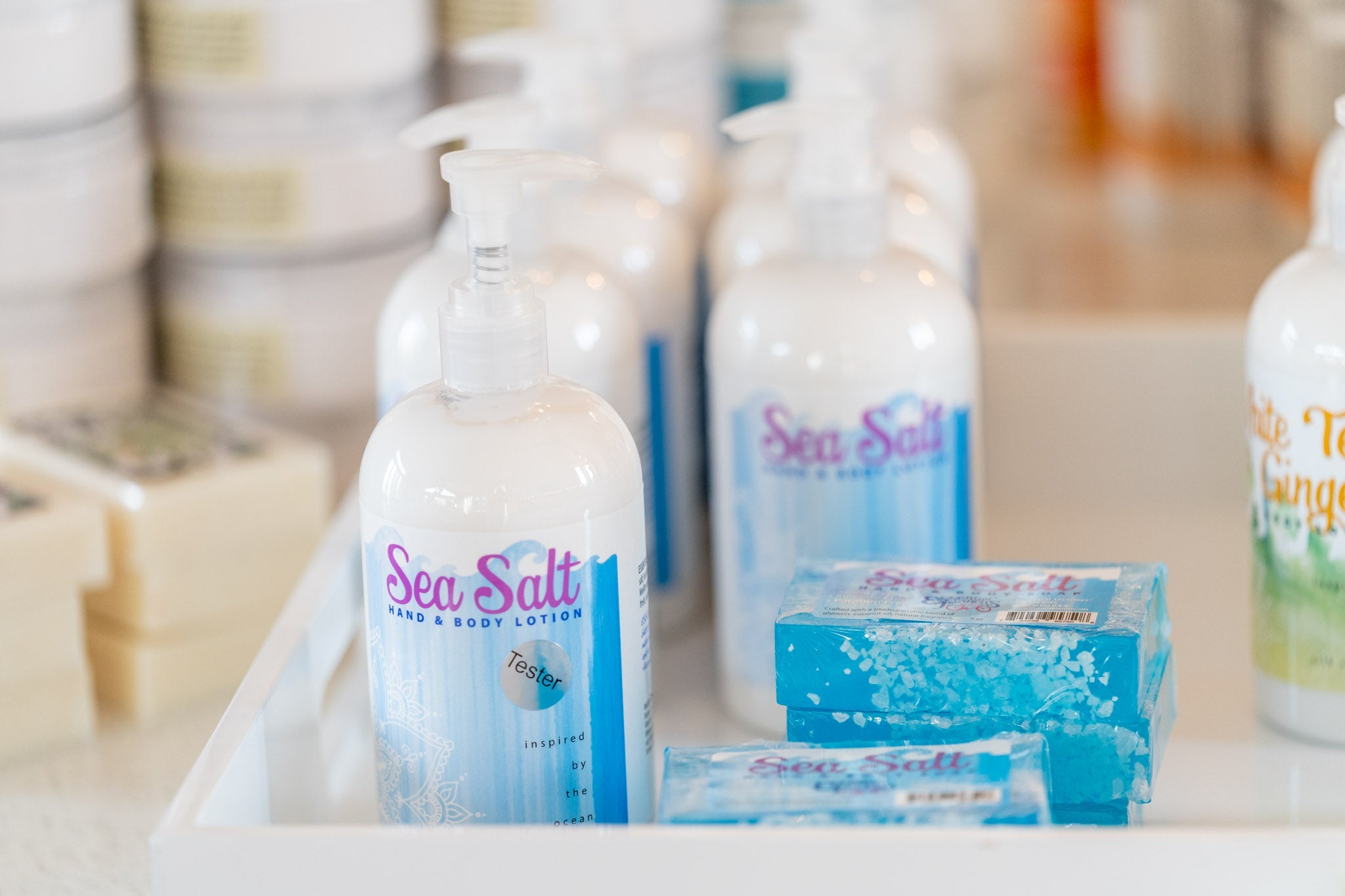 Essential Journeys sea salt hand and body lotion in a 16 oz or 2 oz container, featuring nourishing butters and salves.