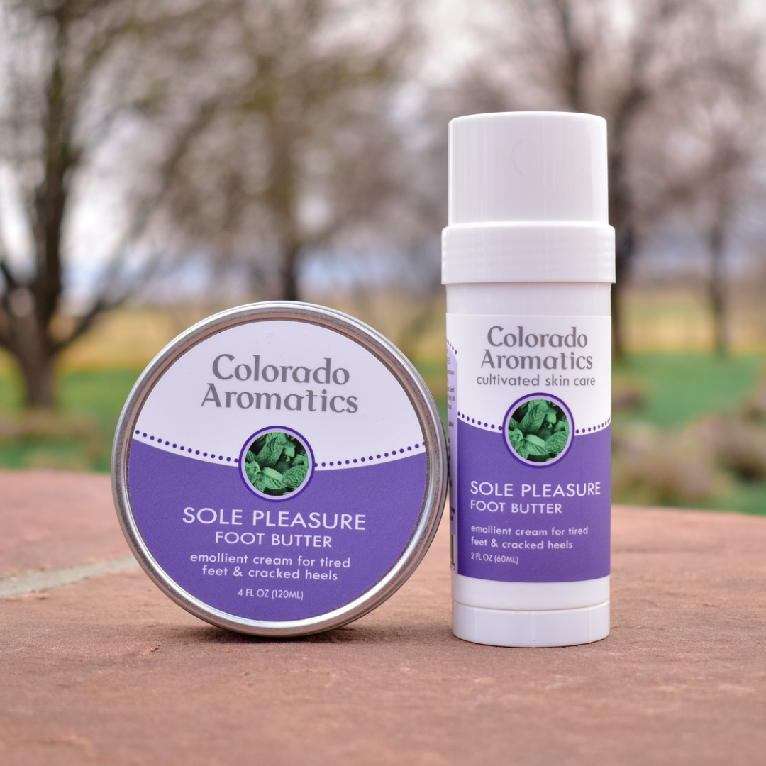 Colorado Aromatics Sole Pleasure Foot Butter balm in a tin and tube, nourishing and moisturizing for smooth, healthy feet.