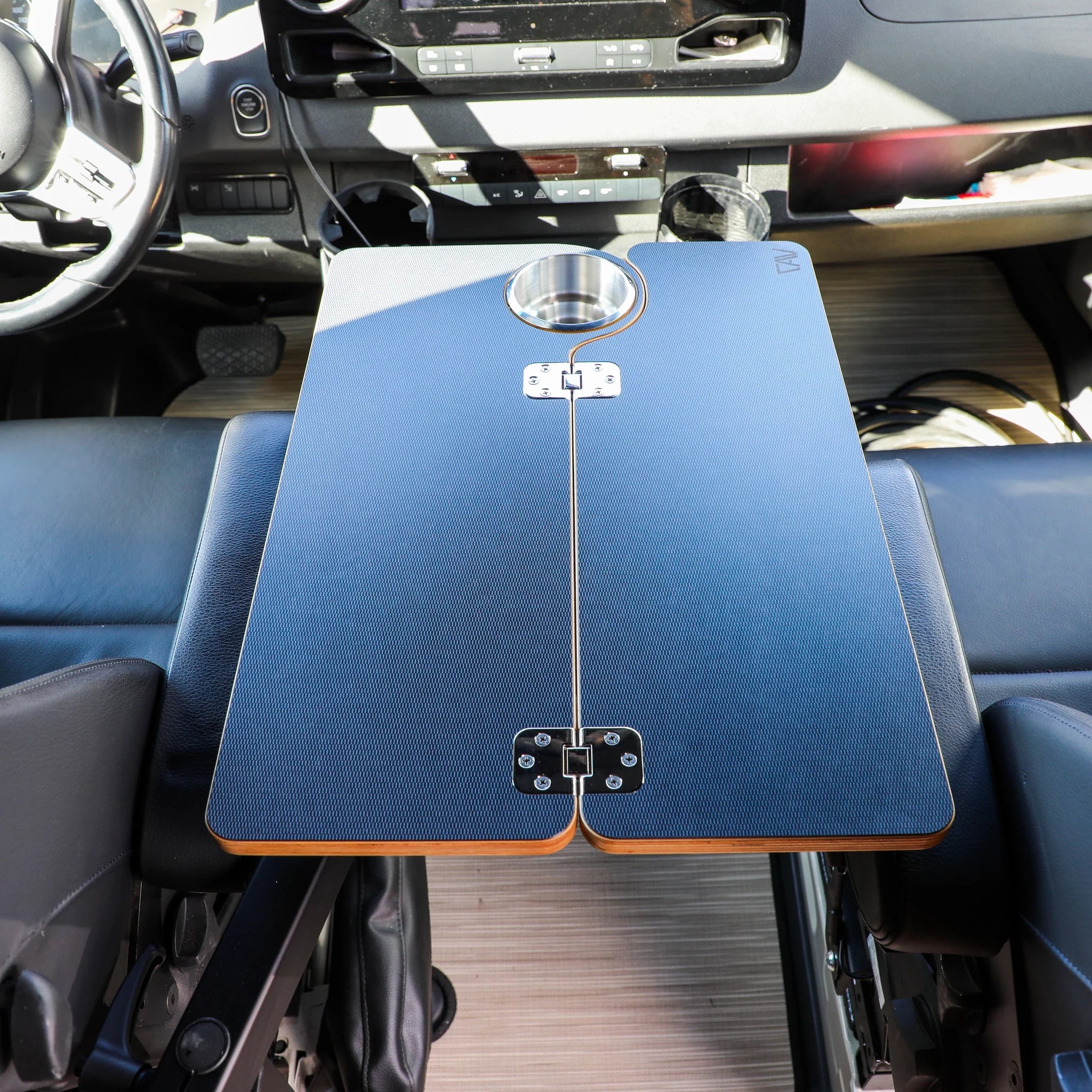 Canyon Adventure Vans Solo Folding Table Top, CAV branded, with smooth surface and foldable design for portable use.