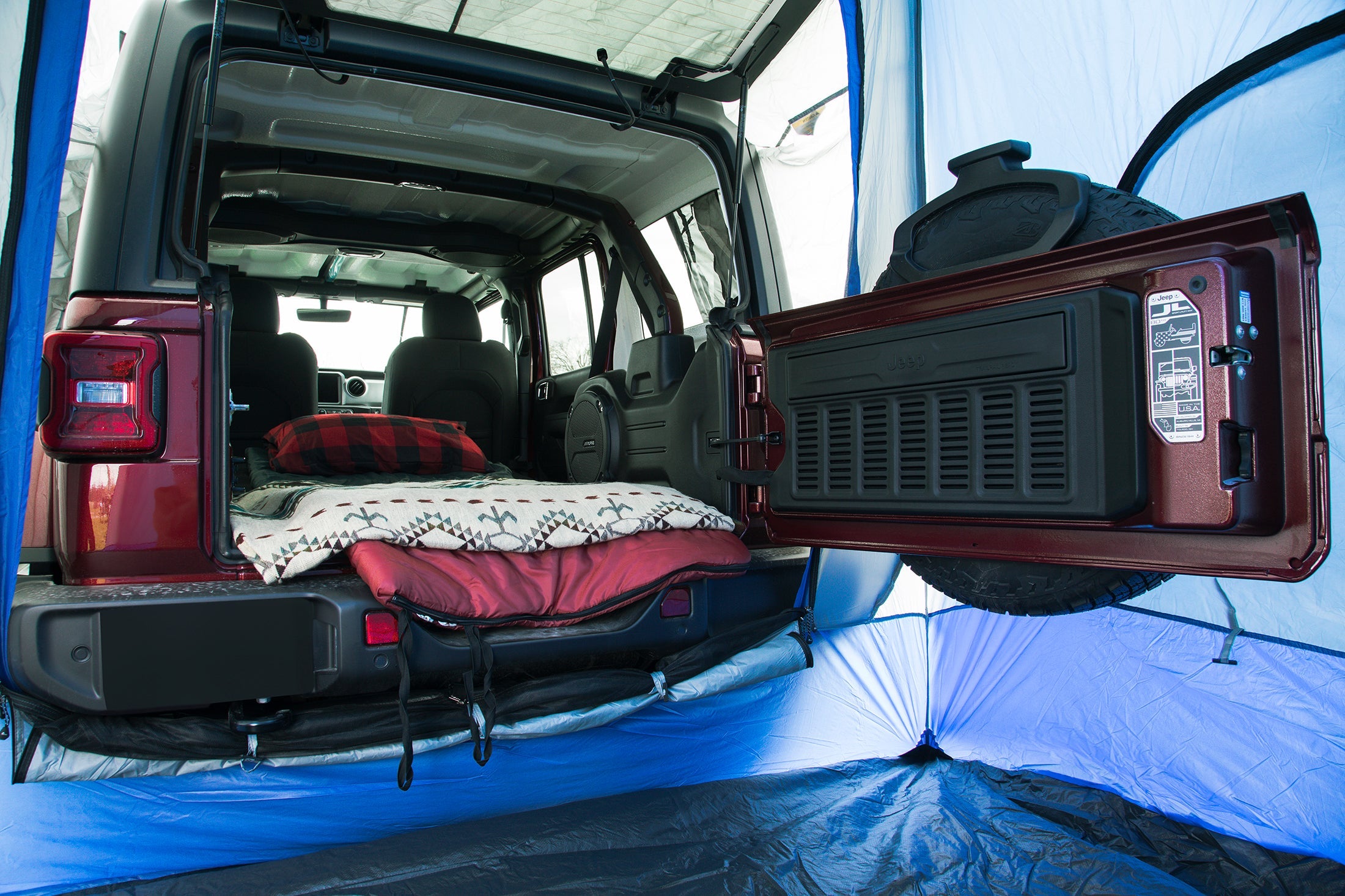 Backcountry Sportsman Sportz SUV Tent attached to a vehicle, showcasing its spacious design and outdoor camping setup.