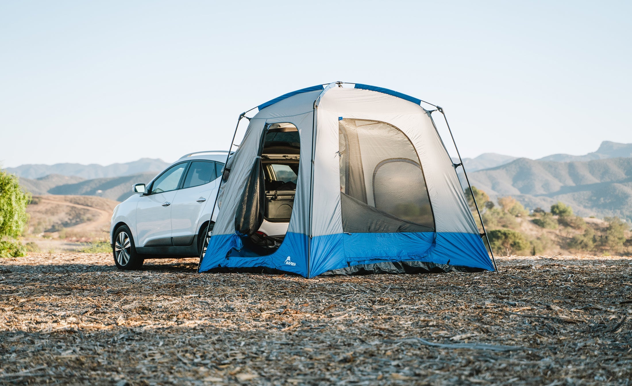 Backcountry Sportsman Sportz SUV Tent set up on a vehicle, showcasing its spacious design and camping setup for outdoor adventures.