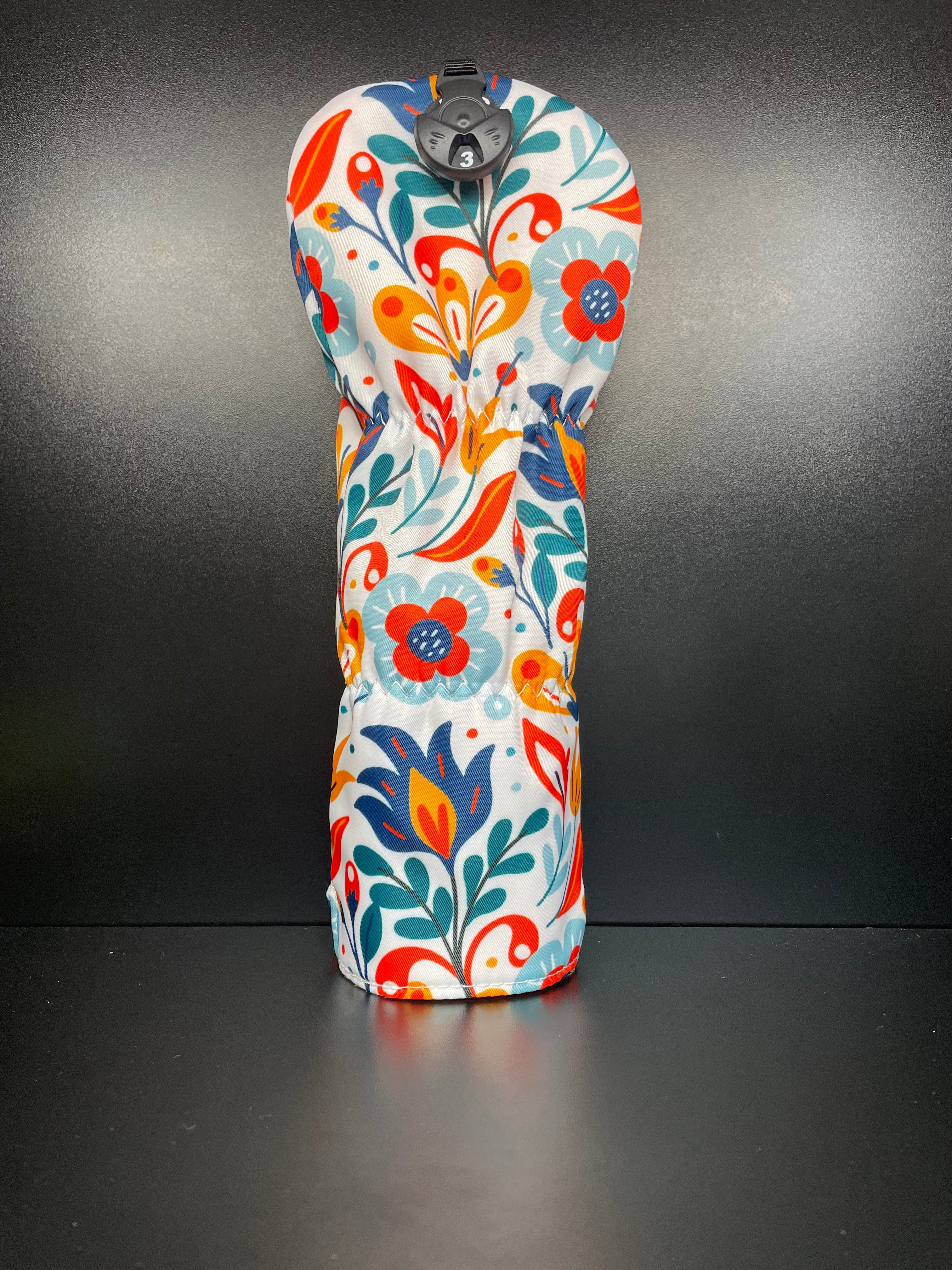 Spring flower golf club headcover by ParWestGolf featuring vibrant floral design and soft fabric for protective fit.