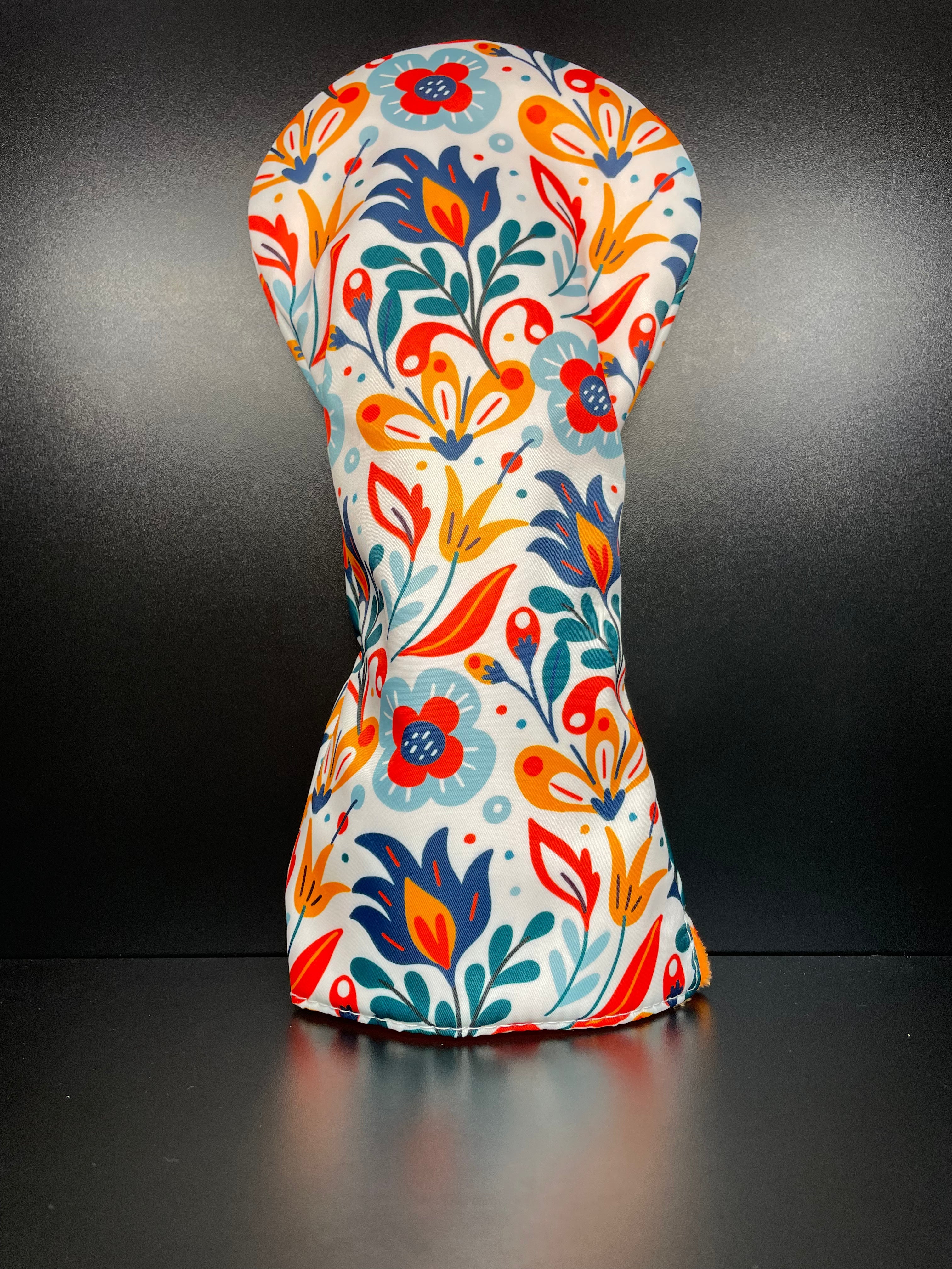 Spring flower golf club headcover by ParWestGolf featuring vibrant floral design for protecting and decorating golf clubs.