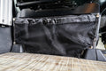 Alpine Van Works Sprinter Seat Base Bags for storage solutions in a van interior, shown attached to vehicle seats.
