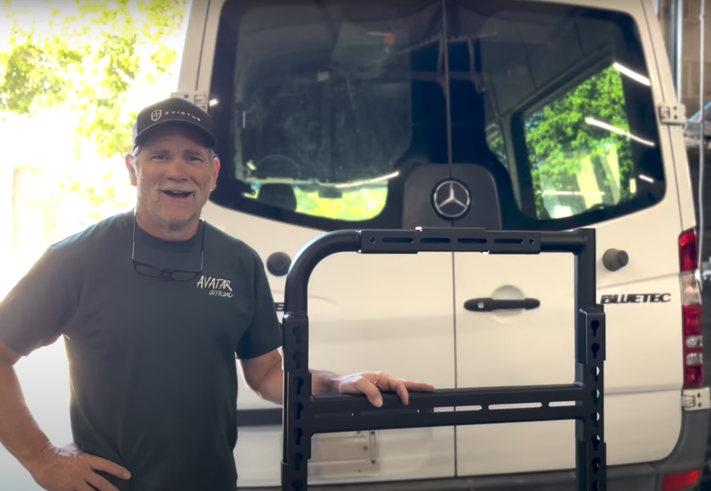 Avatar Offroad Van Rear Door Storage Mounting System installed on a Sprinter van, showing durable metal construction and secure attachment points.