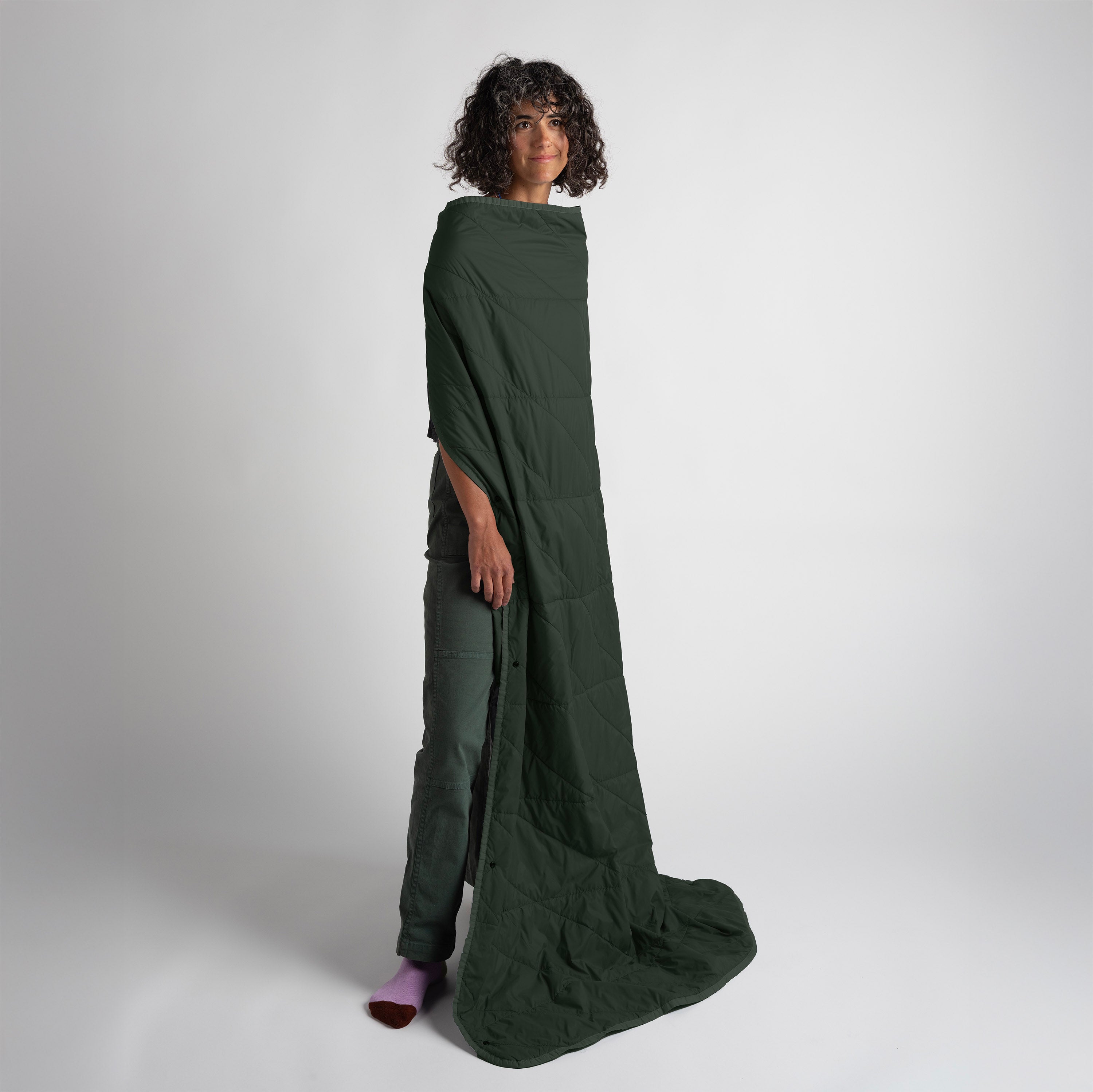 Gravel Layover™ Travel Blanket in Spruce color, soft and cozy fabric ideal for on-the-go comfort during travels.