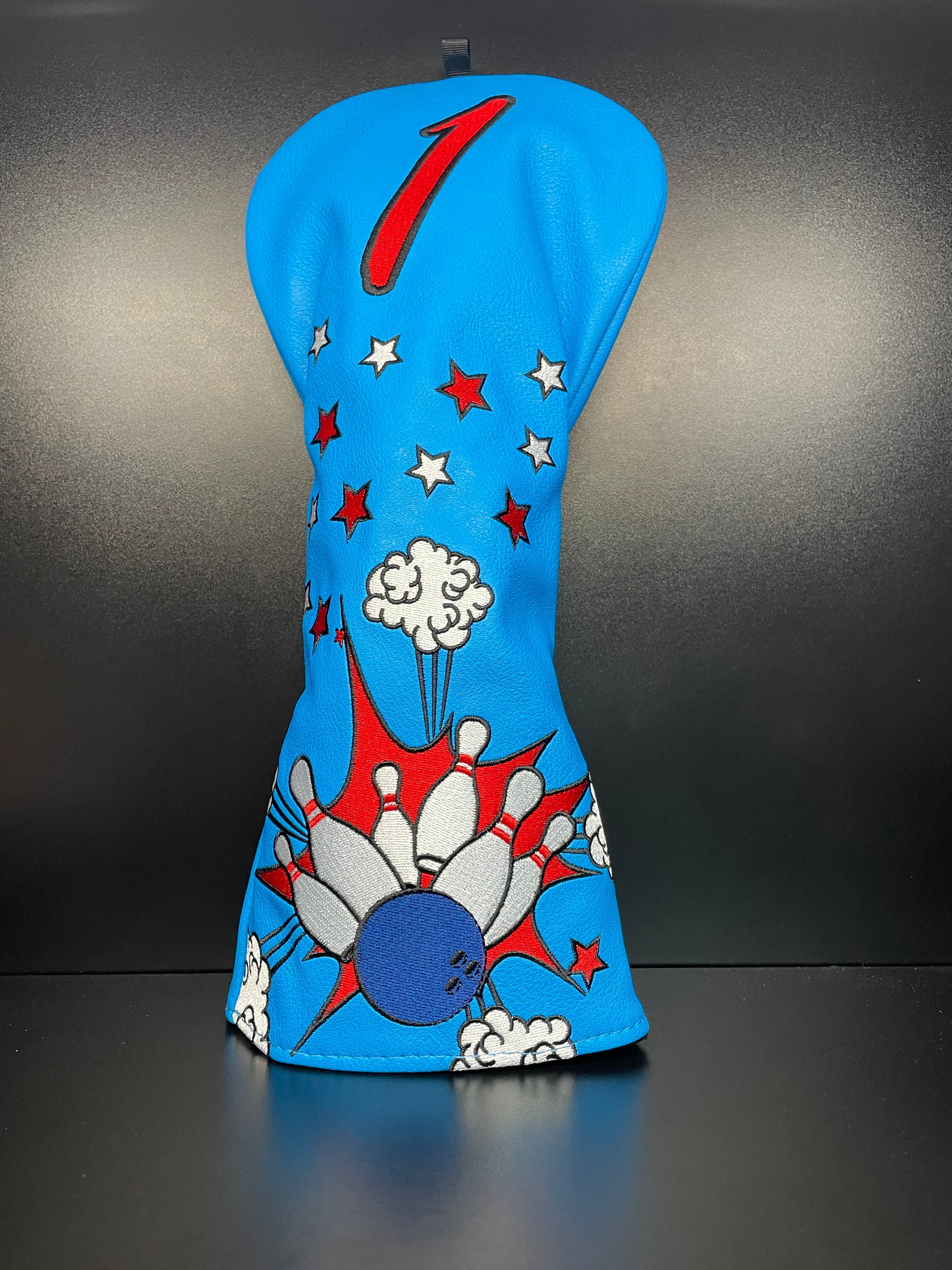 ParWestGolf Strike! bowling-themed golf club headcover with vibrant design, protects golf clubs during play.