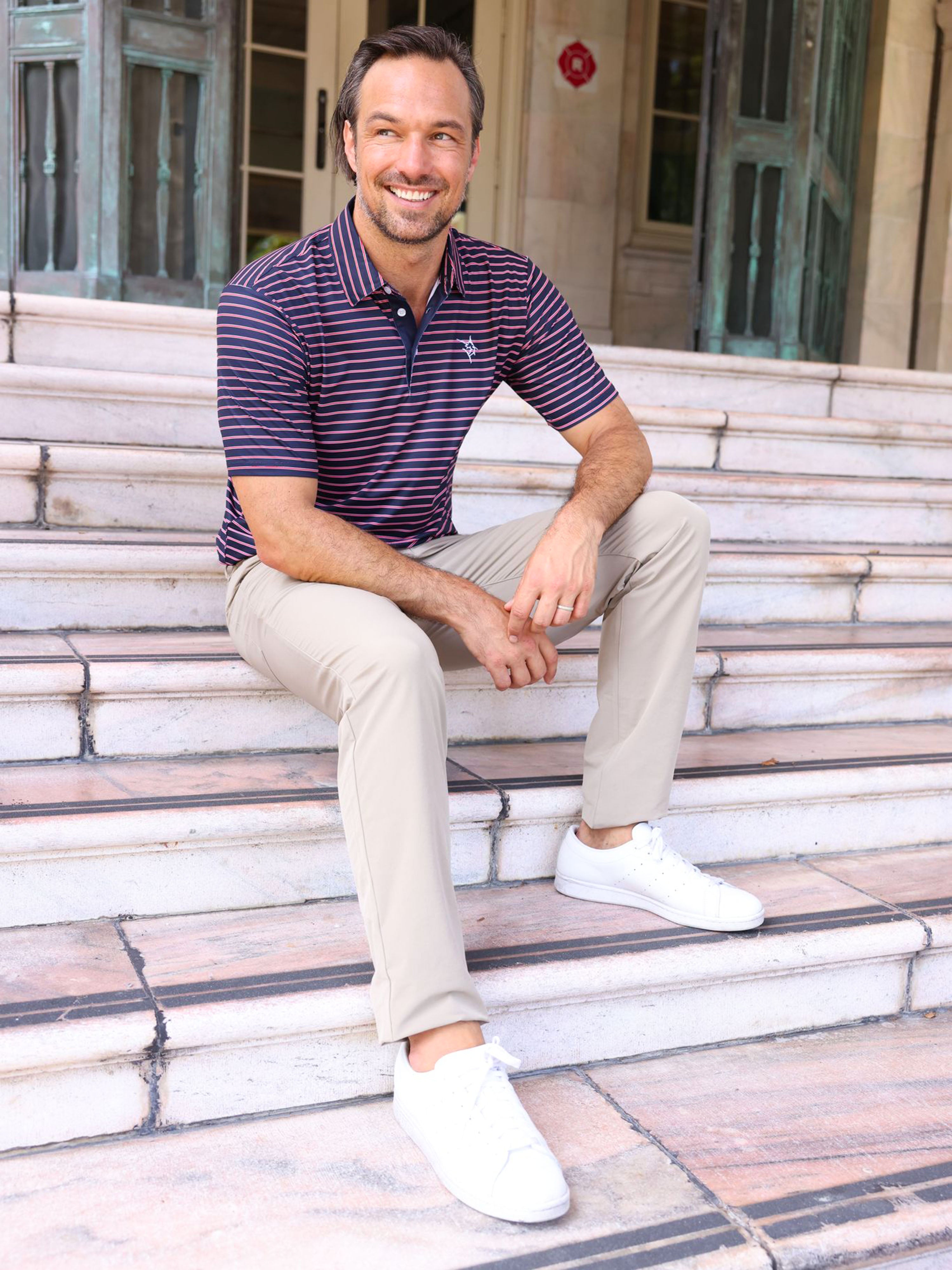 Navy and white striped White Water Life Striper Polo shirt with a classic collar and short sleeves on a mannequin.