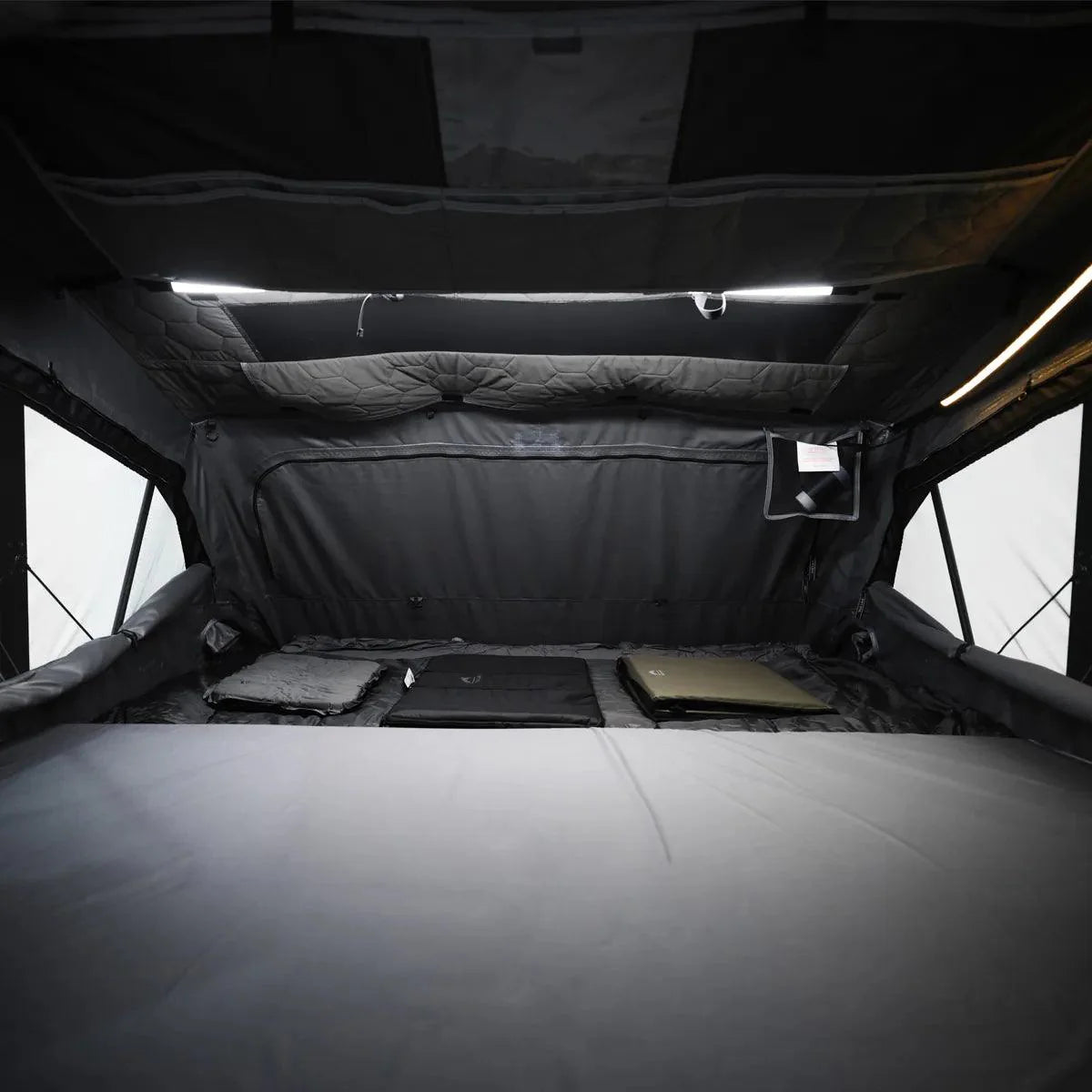 Wild Land OrthFrame Max roof top tent set up on a vehicle, showcasing durable overlanding gear for outdoor camping adventures.