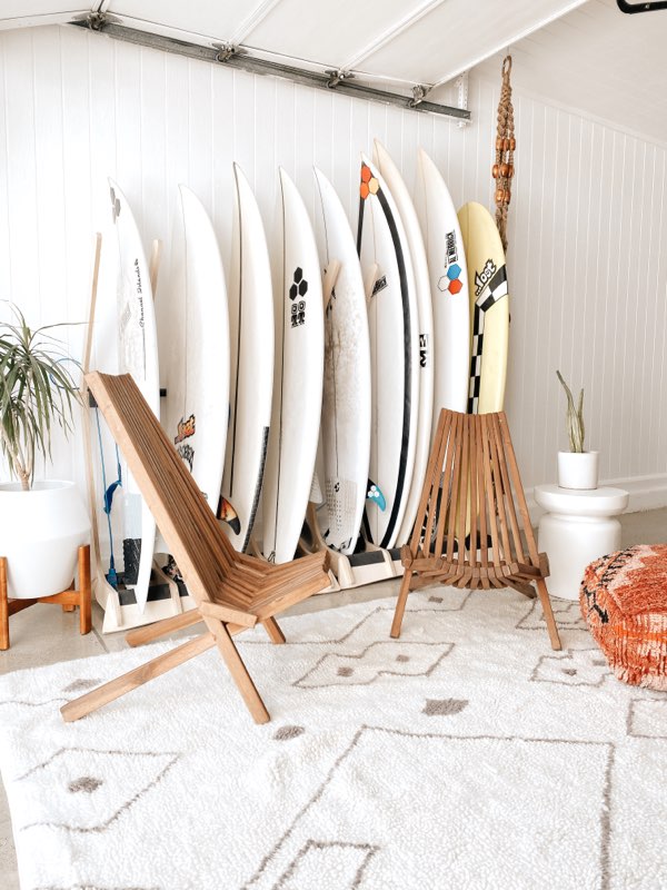 Freestanding surfboard rack by Rado Racks, displaying multiple surfboards in a sleek, organized manner.