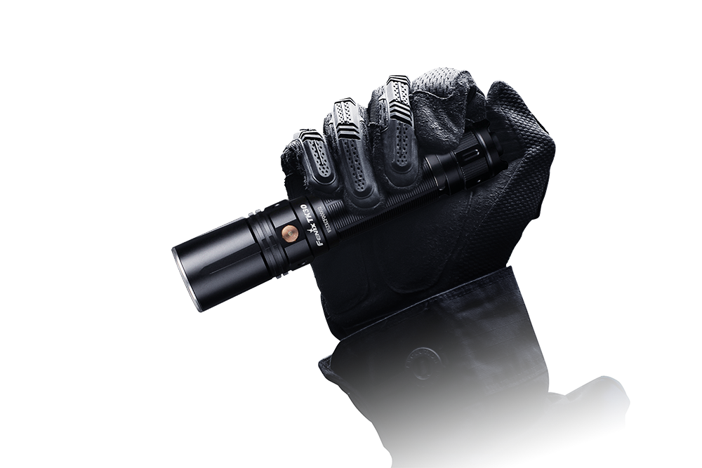 Fenix TK30 tactical flashlight with white laser LED, showcasing its compact design and durable construction.