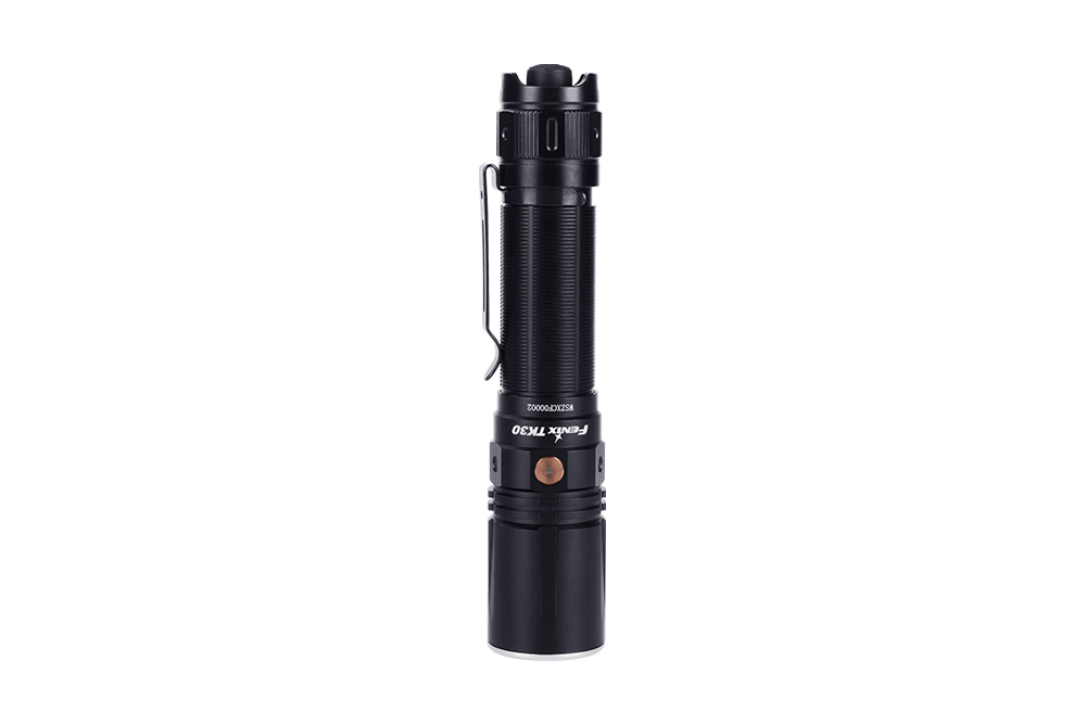 Fenix TK30 tactical flashlight with white laser LED, showcasing a sleek design and durable build in a dark setting.
