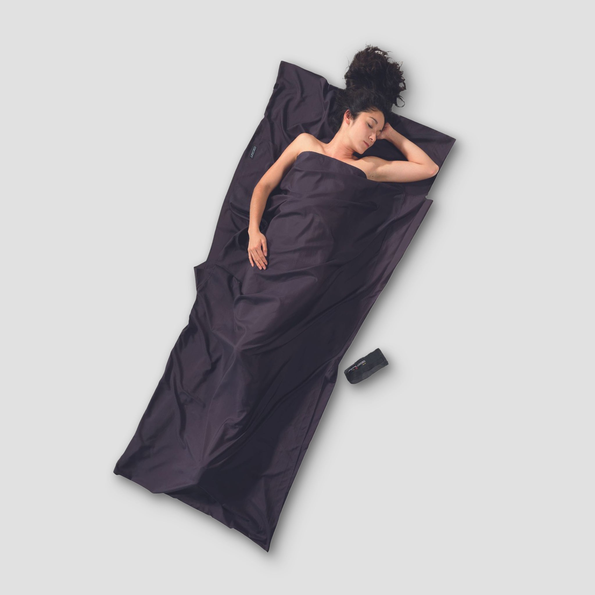 COCOON Travelsheet™ Thermolite® Silkweight in a compact design, showcasing soft, lightweight fabric ideal for travel.