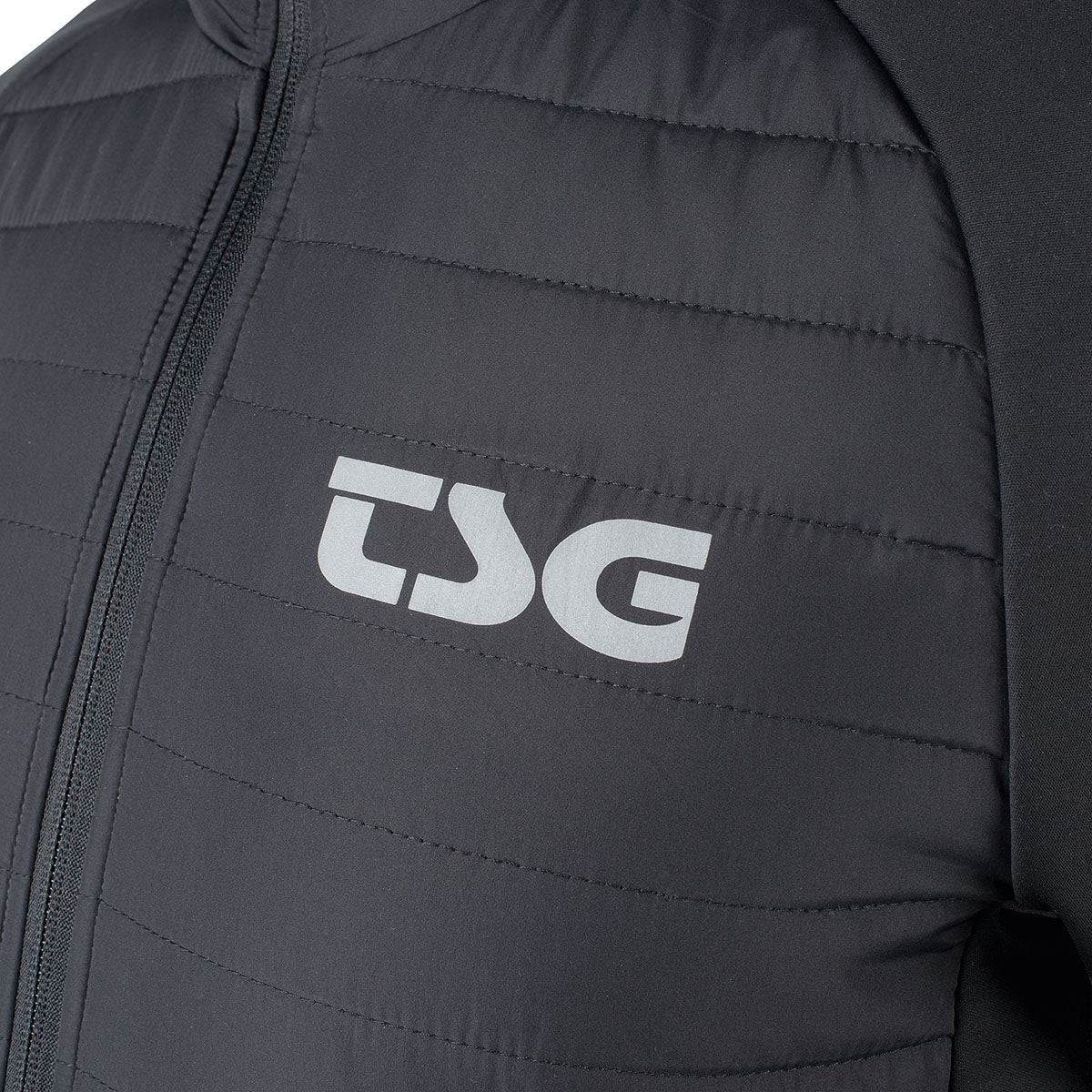 Black TSG insulation jacket by ZEITBIKE, showcasing the lightweight, padded cycling clothing with front zipper and branding details.