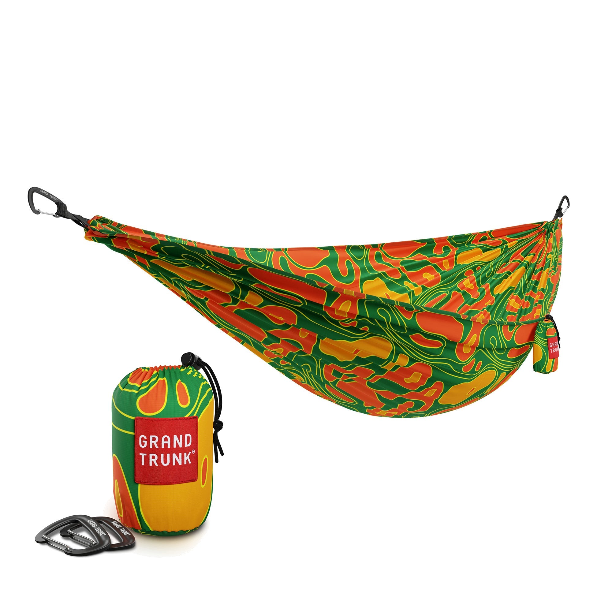 GrandTrunk TRUNKTECH™ hammock with vibrant lava-colored fabric, shown hanging between trees for outdoor relaxation.