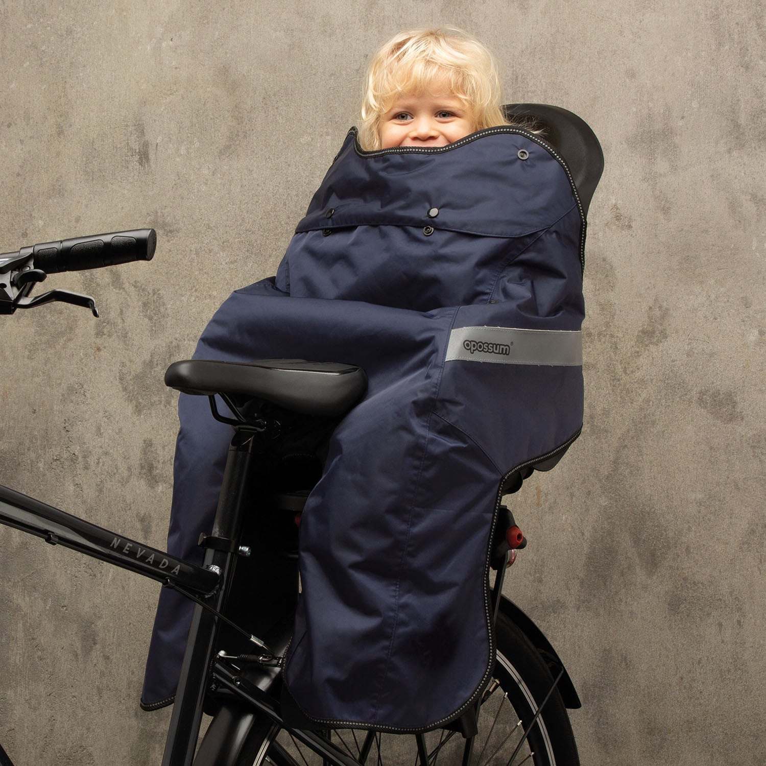 ZEITBIKE Tucano Urbano thermal child bike seat rain cover with hood, waterproof bicycle rain cape for kids, black and grey design.