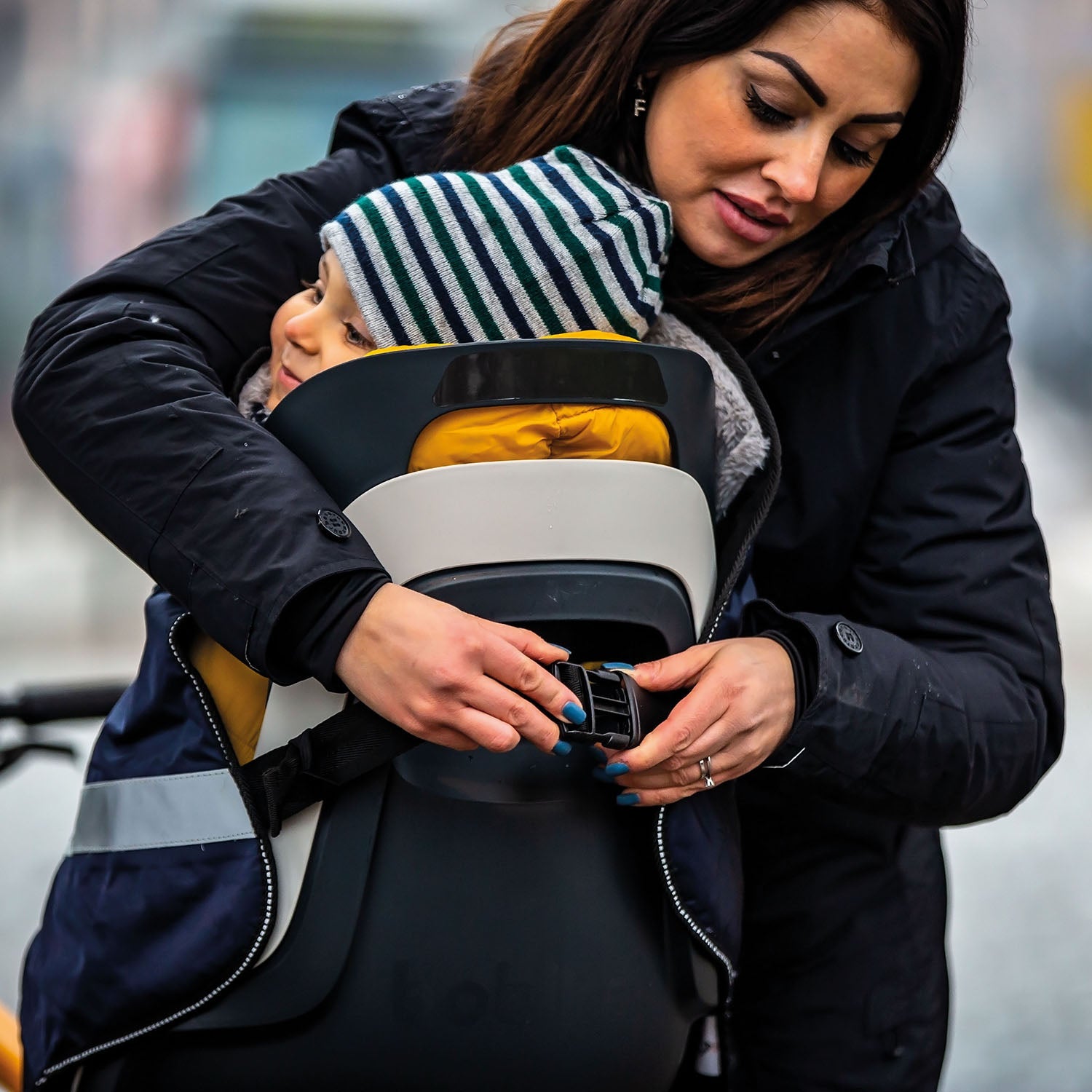 ZEITBIKE Tucano Urbano thermal child bike seat rain cover with hood, designed for protection and comfort during rides in wet weather.
