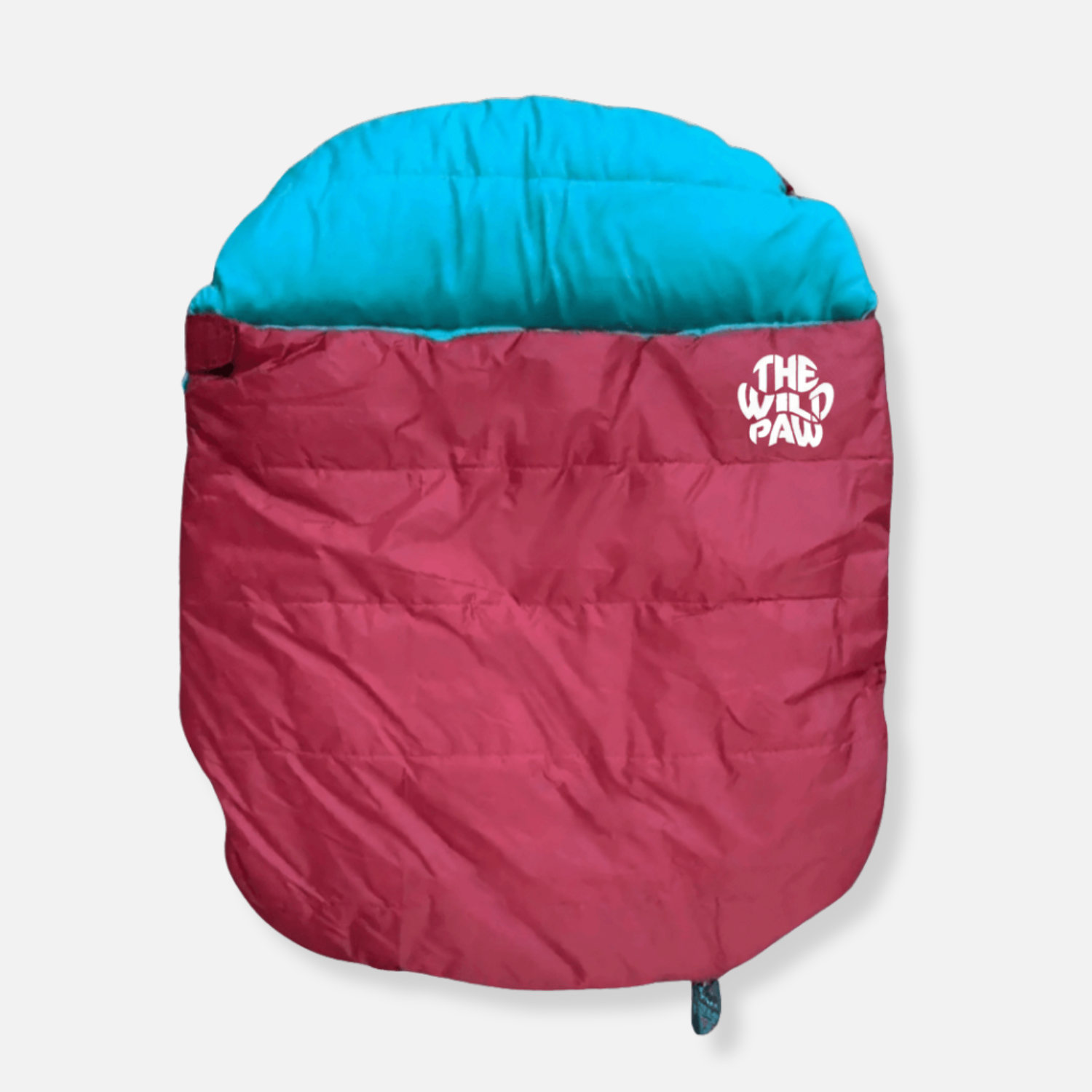 The Wild Paw Trail Lite sleeping bag in olive green, shown outdoors with its compact, lightweight design for camping.